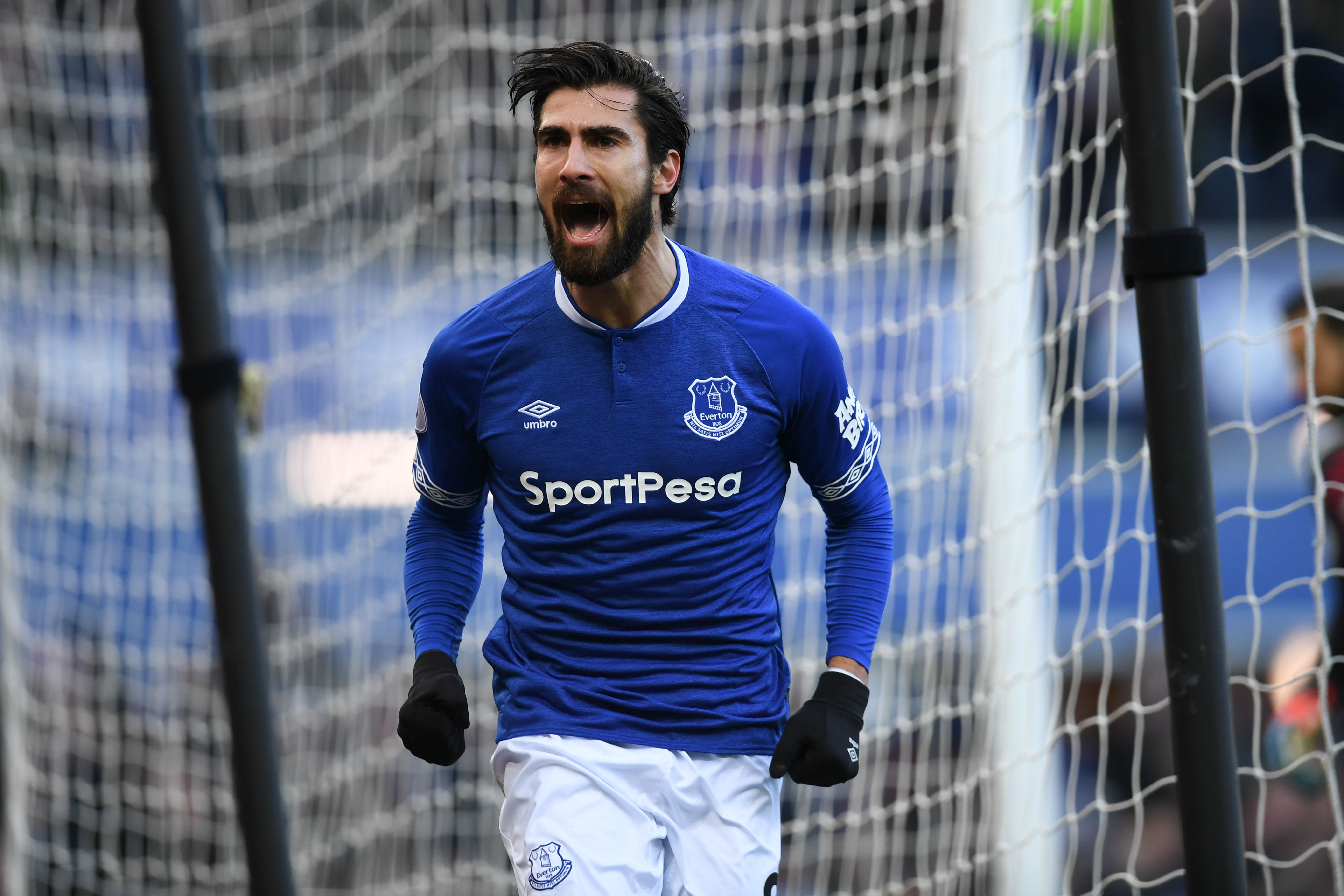 Everton's Portuguese midfielder André Gomes celebrates scoring their first goal to equalise 1-1 during the English Premier League football match between Everton and Wolverhampton Wanderers at Goodison Park in Liverpool, north west England on February 2, 2019. (Photo by Paul ELLIS / AFP) / RESTRICTED TO EDITORIAL USE. No use with unauthorized audio, video, data, fixture lists, club/league logos or 'live' services. Online in-match use limited to 120 images. An additional 40 images may be used in extra time. No video emulation. Social media in-match use limited to 120 images. An additional 40 images may be used in extra time. No use in betting publications, games or single club/league/player publications. /         (Photo credit should read PAUL ELLIS/AFP/Getty Images)