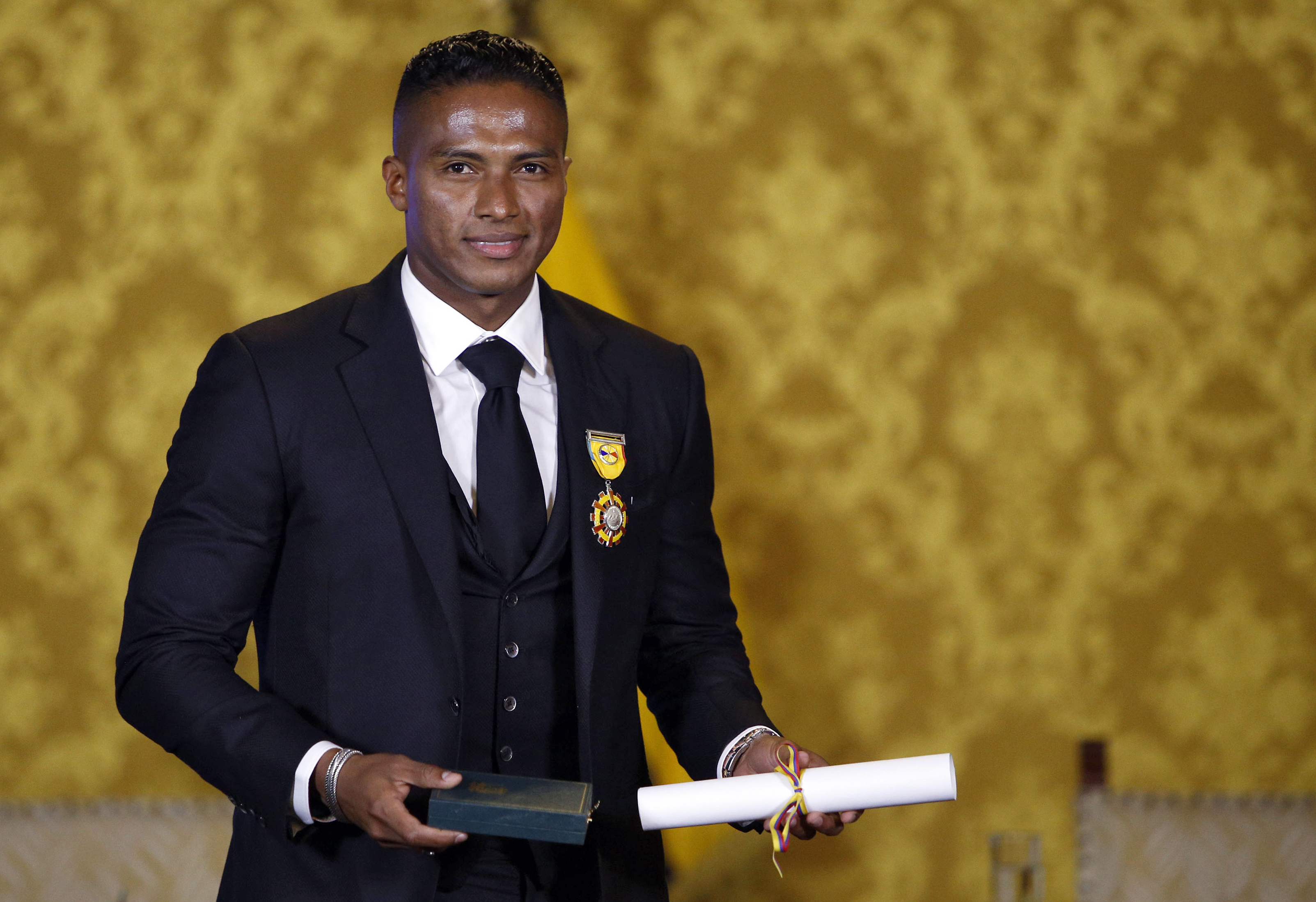 Ex-Manchester United Ecuadorean footballer Luis Antonio Valencia poses after being decorated by Ecuadorean President Lenin Moreno with the National Order of Merit for his professional sport career, at Carondelet Presidential Palace in Quito on May 14, 2019. (Photo by Cristina VEGA / AFP)        (Photo credit should read CRISTINA VEGA/AFP/Getty Images)