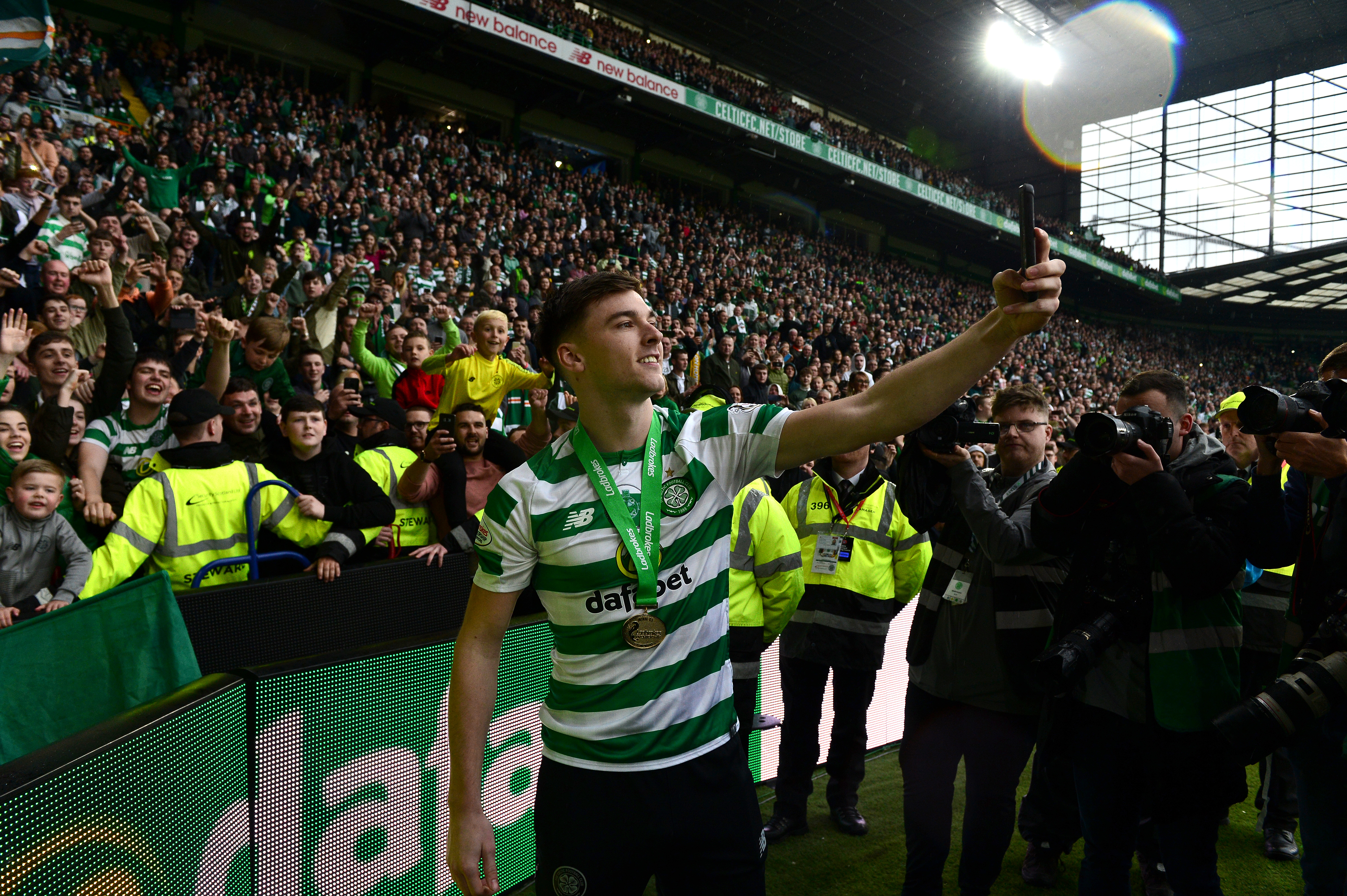 GLASGOW, SCOTLAND - MAY 19: Kieran Tierney of Celtic takes a selfie with the Celtic fans during the Ladbrokes Scottish Premiership match between Celtic FC and Heart of Midlothian FC at Celtic Park on May 19, 2019 in Glasgow, Scotland. (Photo by Mark Runnacles/Getty Images)