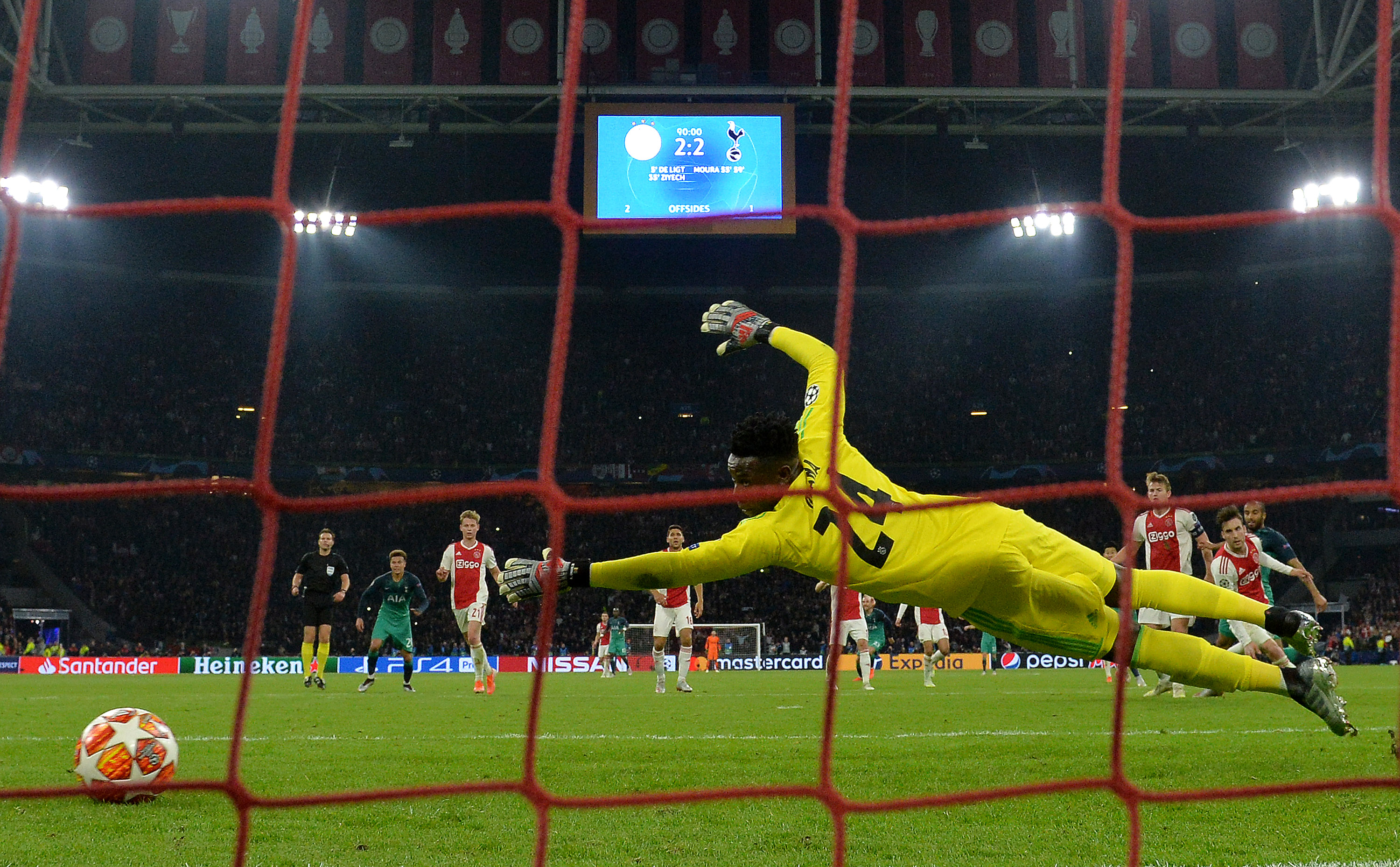 AMSTERDAM, NETHERLANDS - MAY 08: Andre Onana of Ajax dives as Lucas Moura of Tottenham Hotspur (obscure) scores his team's third goal during the UEFA Champions League Semi Final second leg match between Ajax and Tottenham Hotspur at the Johan Cruyff Arena on May 08, 2019 in Amsterdam, Netherlands. (Photo by Dan Mullan/Getty Images )