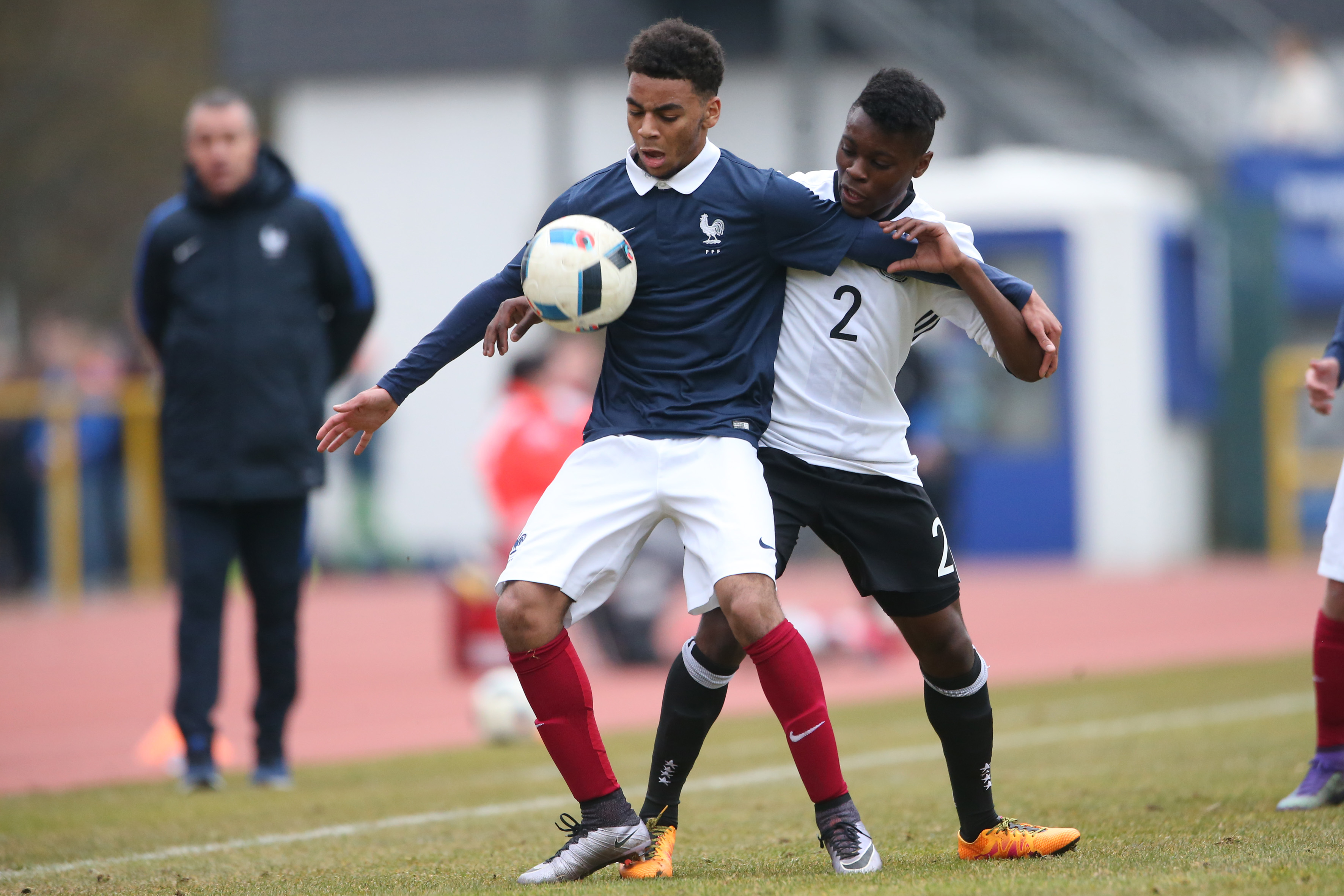 Konz, Germany - March 24: Bote Nzuzi Baku of Germany challenges Alexis Claude-Maurice of France during the friendly match between U18 Germany and U18 France at Saar-Mosel-Stadium on March 24, 2016 in Konz, Germany.(Photo by Andreas Schlichter/Bongarts/Getty Images)