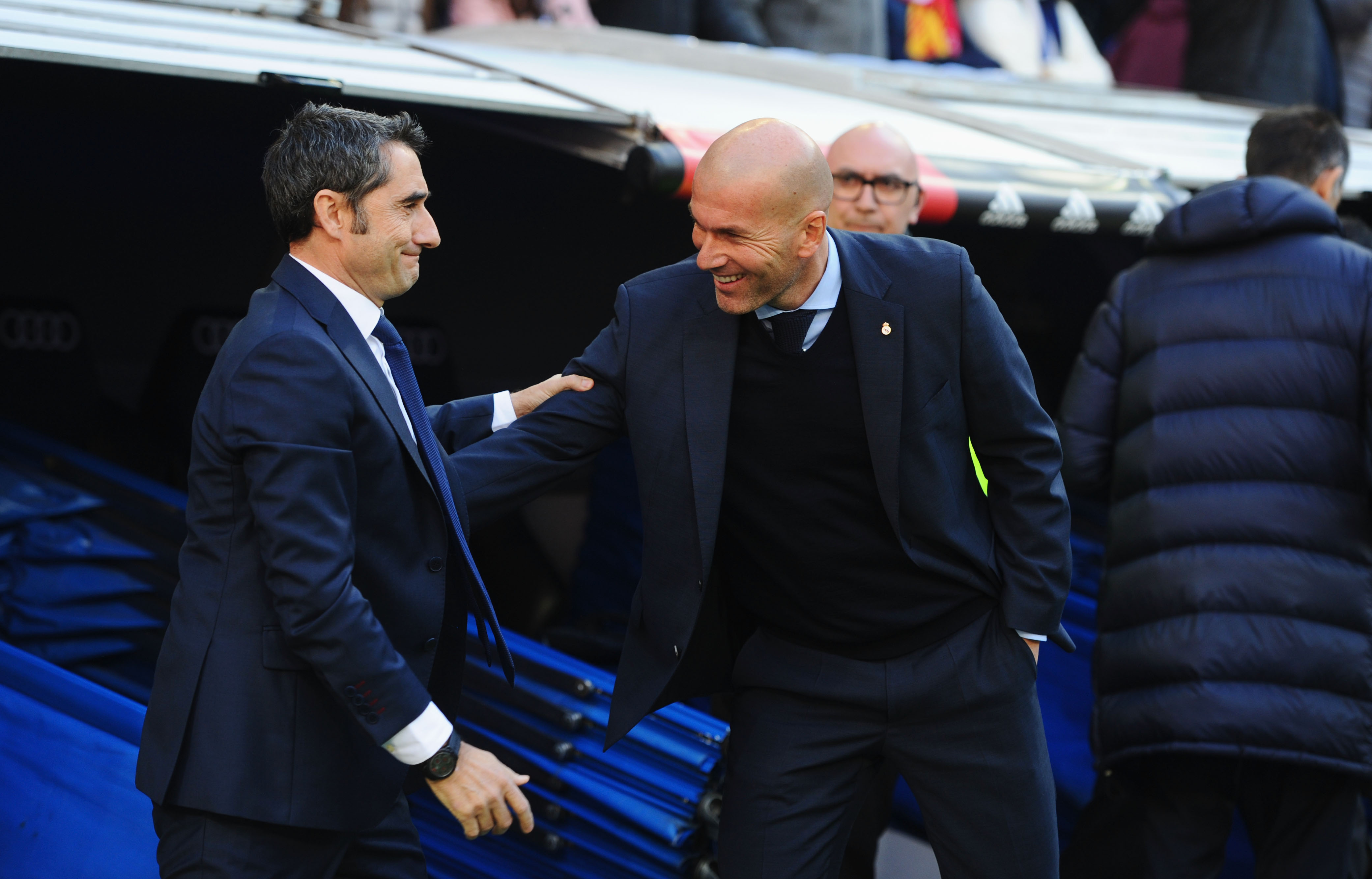 MADRID, SPAIN - DECEMBER 23:  Zinedine Zidane, Manager of Real Madrid greets Ernesto Valverde, coach of Barcelona prior to the La Liga match between Real Madrid and Barcelona at Estadio Santiago Bernabeu on December 23, 2017 in Madrid, Spain.  (Photo by Denis Doyle/Getty Images)