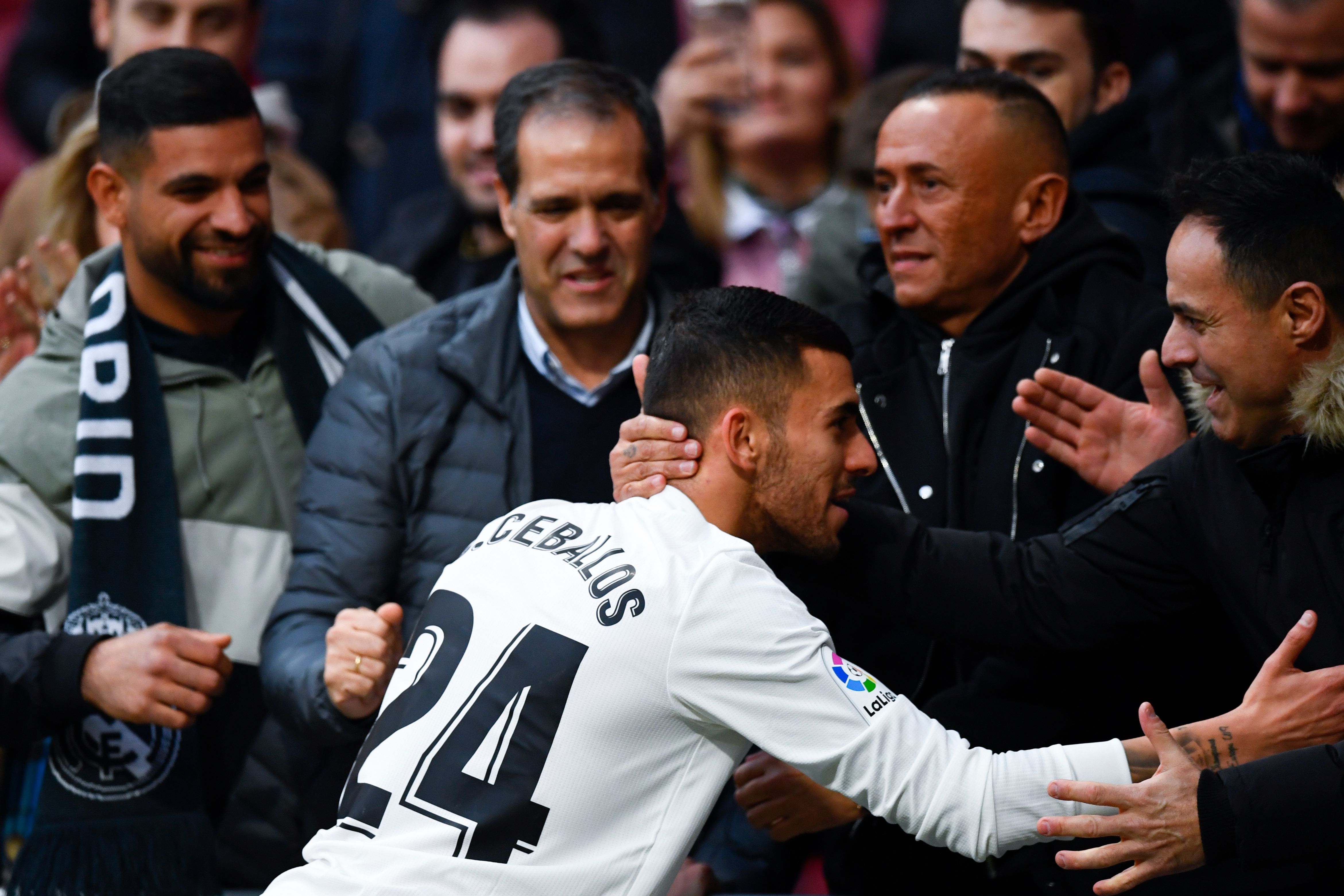Real Madrid's Spanish midfielder Daniel Ceballos (C) is congratulated at the end of the Spanish league football match between Club Atletico de Madrid and Real Madrid CF at the Wanda Metropolitano stadium in Madrid on February 9, 2019. (Photo by GABRIEL BOUYS / AFP)        (Photo credit should read GABRIEL BOUYS/AFP/Getty Images)