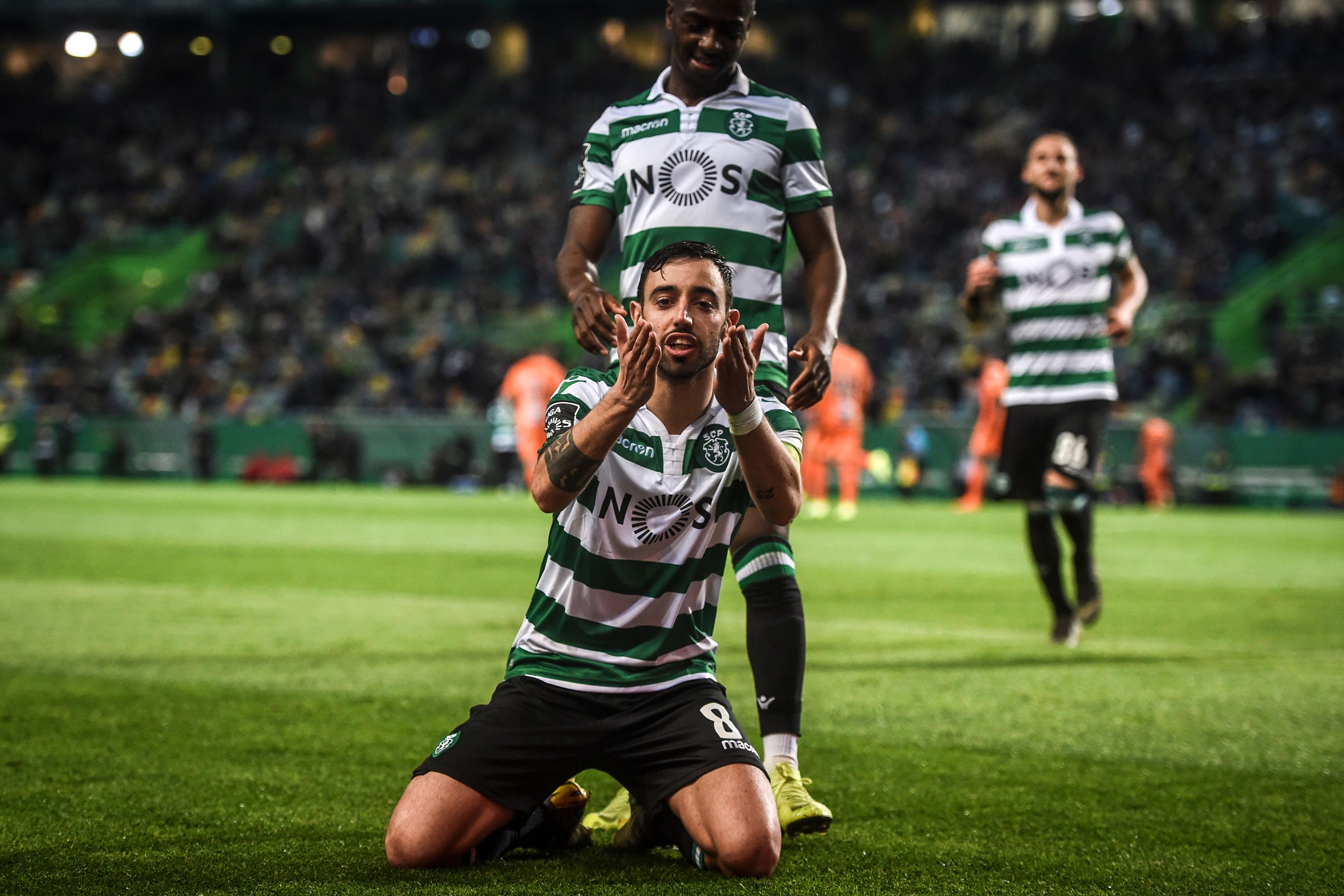 Sporting's Portuguese midfielder Bruno Fernandes (front) celebrates after scoring a goal during the Portuguese league football match between Sporting CP and Portimonense SC at the Jose Alvalade stadium in Lisbon on March 3, 2019. (Photo by PATRICIA DE MELO MOREIRA / AFP)        (Photo credit should read PATRICIA DE MELO MOREIRA/AFP/Getty Images)