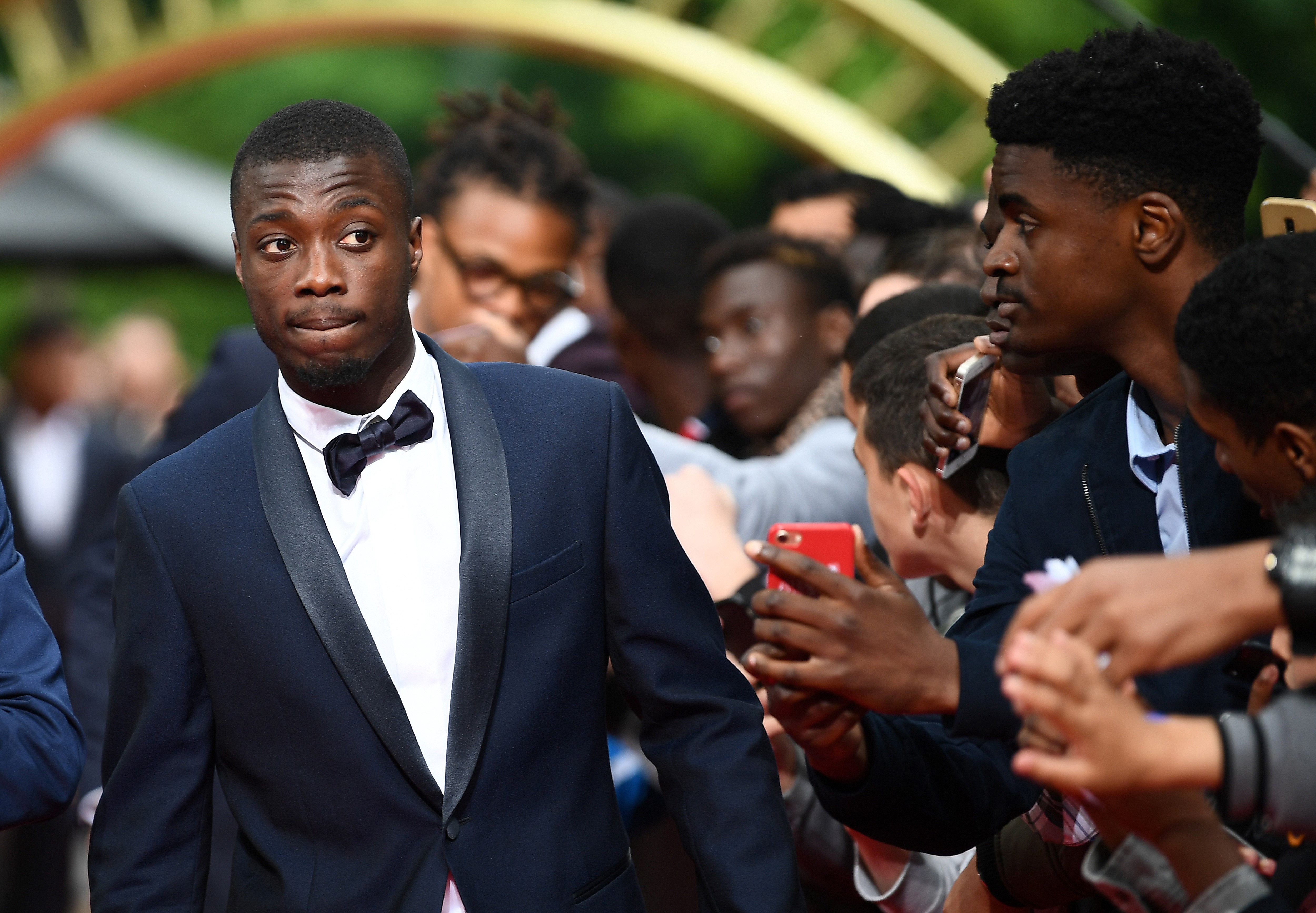 Lille forward Nicolas Pepe arrives to take part in a TV show on May 19, 2019 in Paris, as part of the 28th edition of the UNFP (French National Professional Football players Union) trophy ceremony. (Photo by FRANCK FIFE / AFP)        (Photo credit should read FRANCK FIFE/AFP/Getty Images)