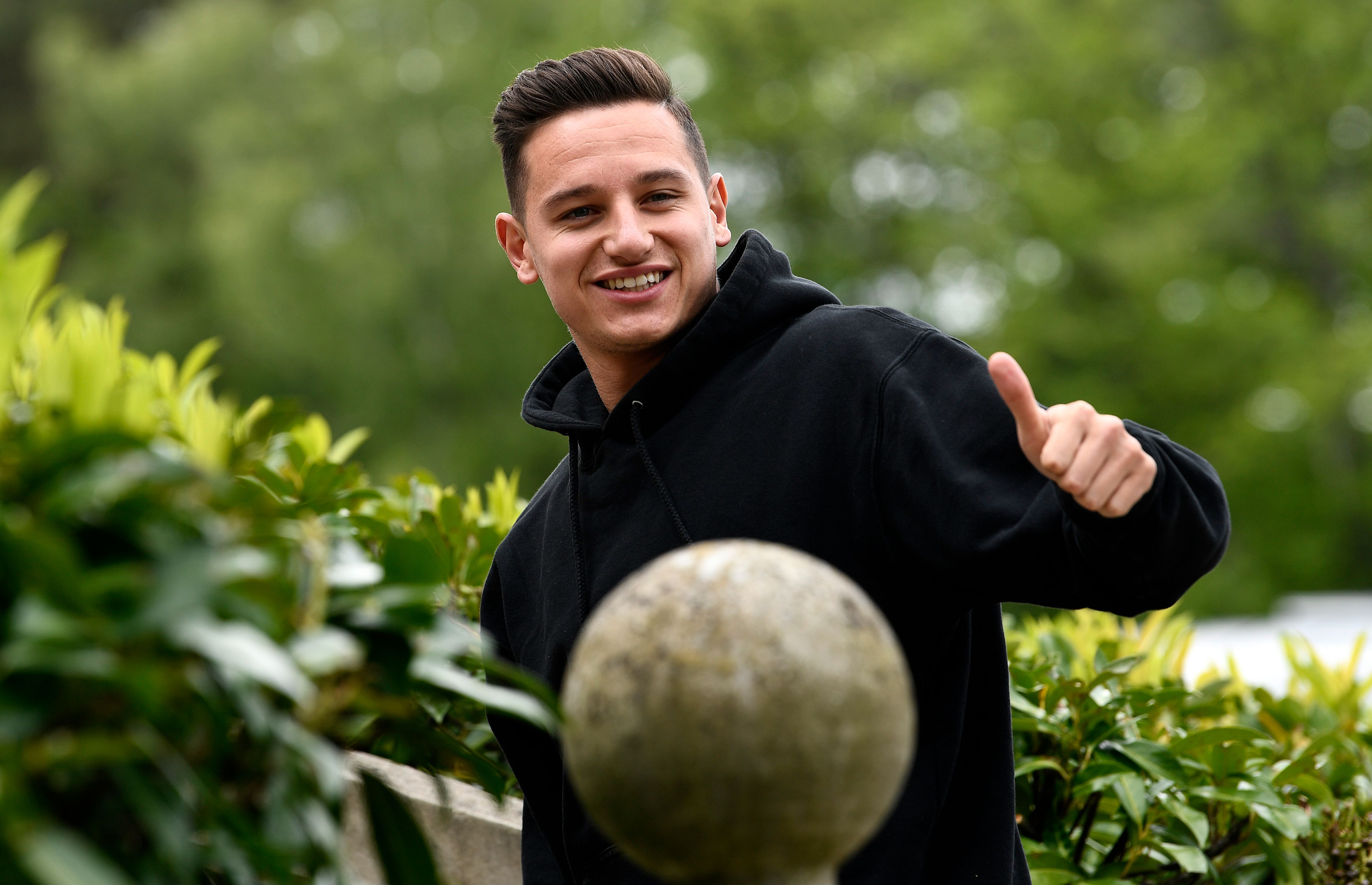 France's forward Florian Thauvin gestures as he arrives at the French national football team training base in Clairefontaine-en-Yvelines on May 29, 2019 as part of the team's preparation for the UEFA Euro 2020 qualifying Group H matches against Turkey and Andorra. (Photo by FRANCK FIFE / AFP)        (Photo credit should read FRANCK FIFE/AFP/Getty Images)