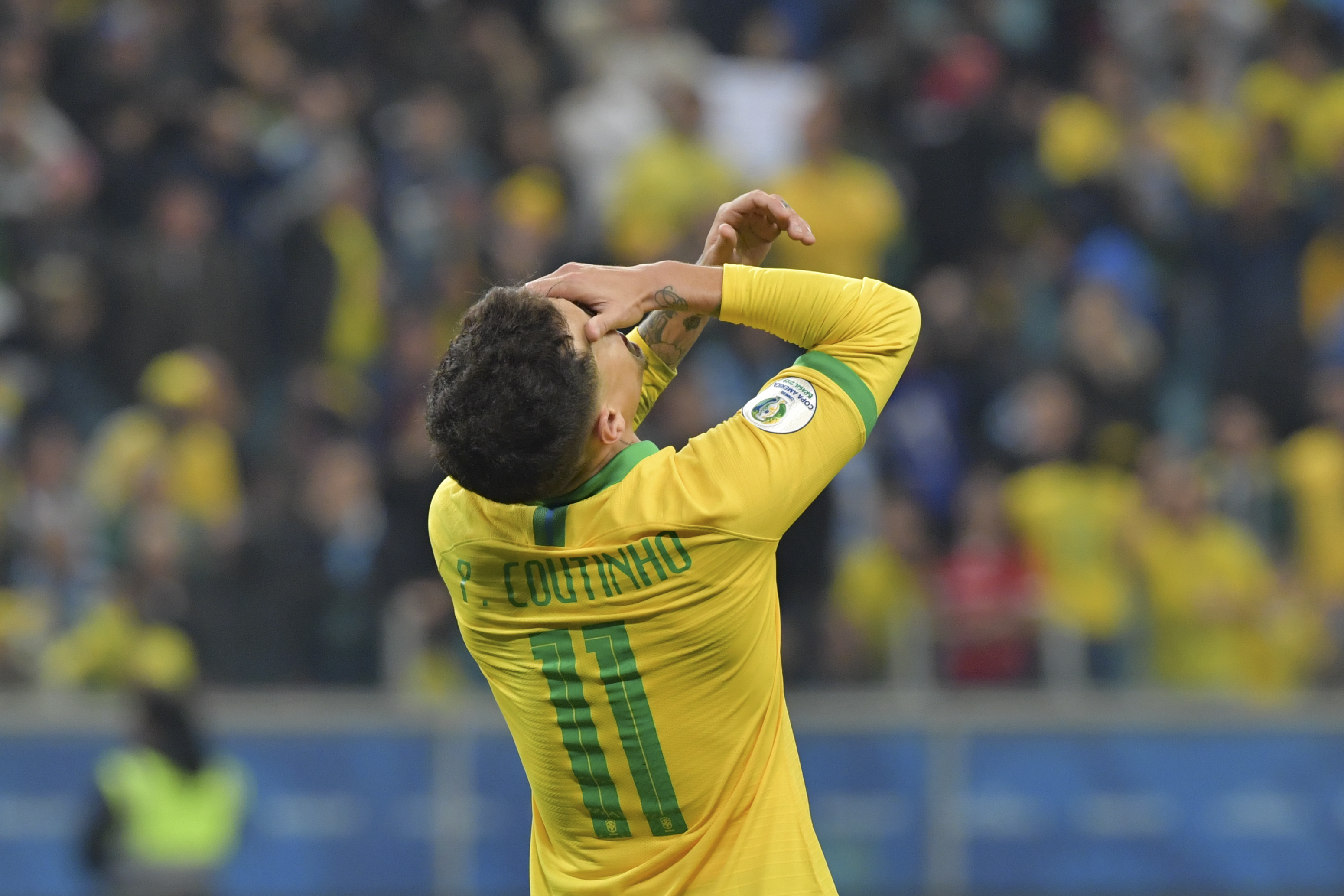 Brazil's Philippe Coutinho gestures after tying with Paraguay 0-0 and going the the penalty shoot-out during their Copa America football tournament quarter-final match at the Gremio Arena in Porto Alegre, Brazil, on June 27, 2019. (Photo by Luis ACOSTA / AFP)        (Photo credit should read LUIS ACOSTA/AFP/Getty Images)