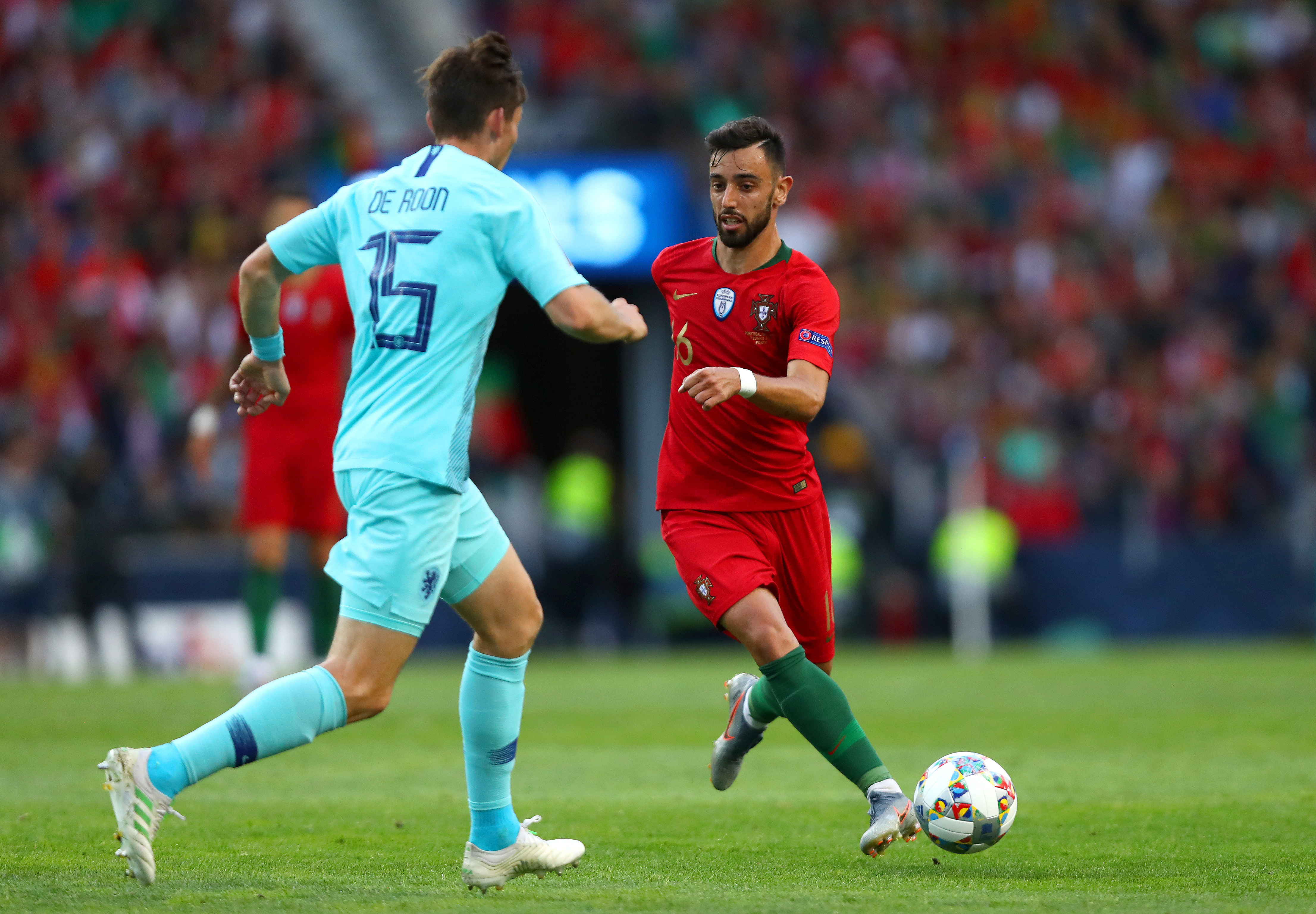 PORTO, PORTUGAL - JUNE 09: Bruno Fernandes of Portugal takes on Marten de Roon of the Netherlands during the UEFA Nations League Final between Portugal and the Netherlands at Estadio do Dragao on June 09, 2019 in Porto, Portugal. (Photo by Dean Mouhtaropoulos/Getty Images)