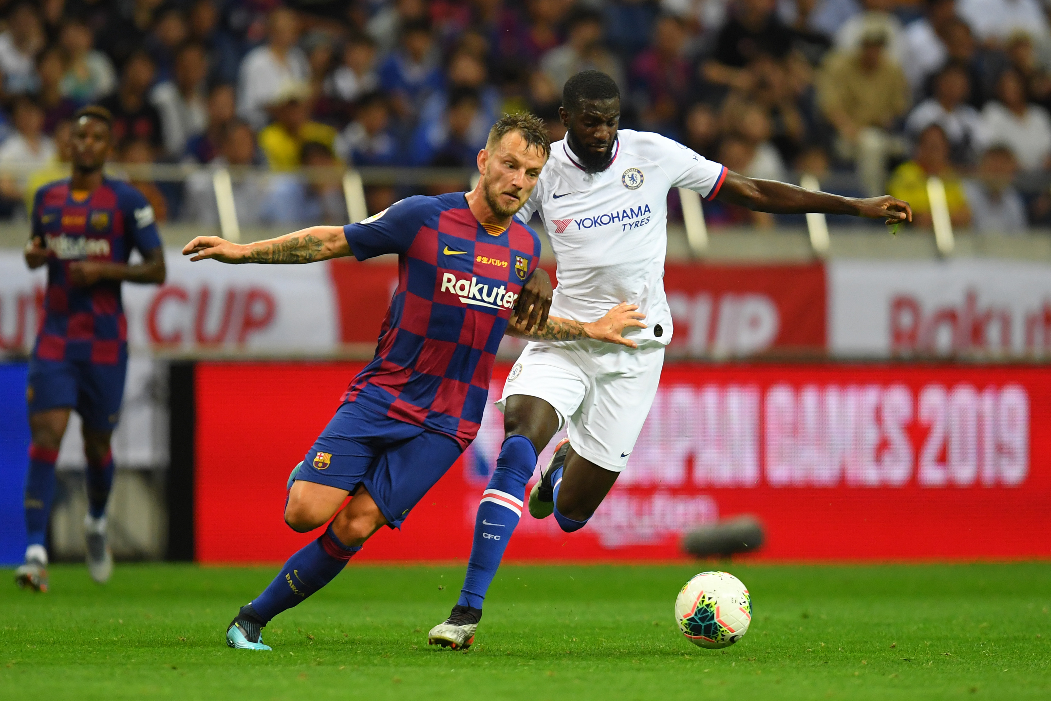 SAITAMA, JAPAN - JULY 23: Ivan Rakitic of Barcelona and Tiemoue Bakayoko of Chelsea compete for the ball during the preseason friendly match between Barcelona and Chelsea at the Saitama Stadium on July 23, 2019 in Saitama, Japan. (Photo by Atsushi Tomura/Getty Images)