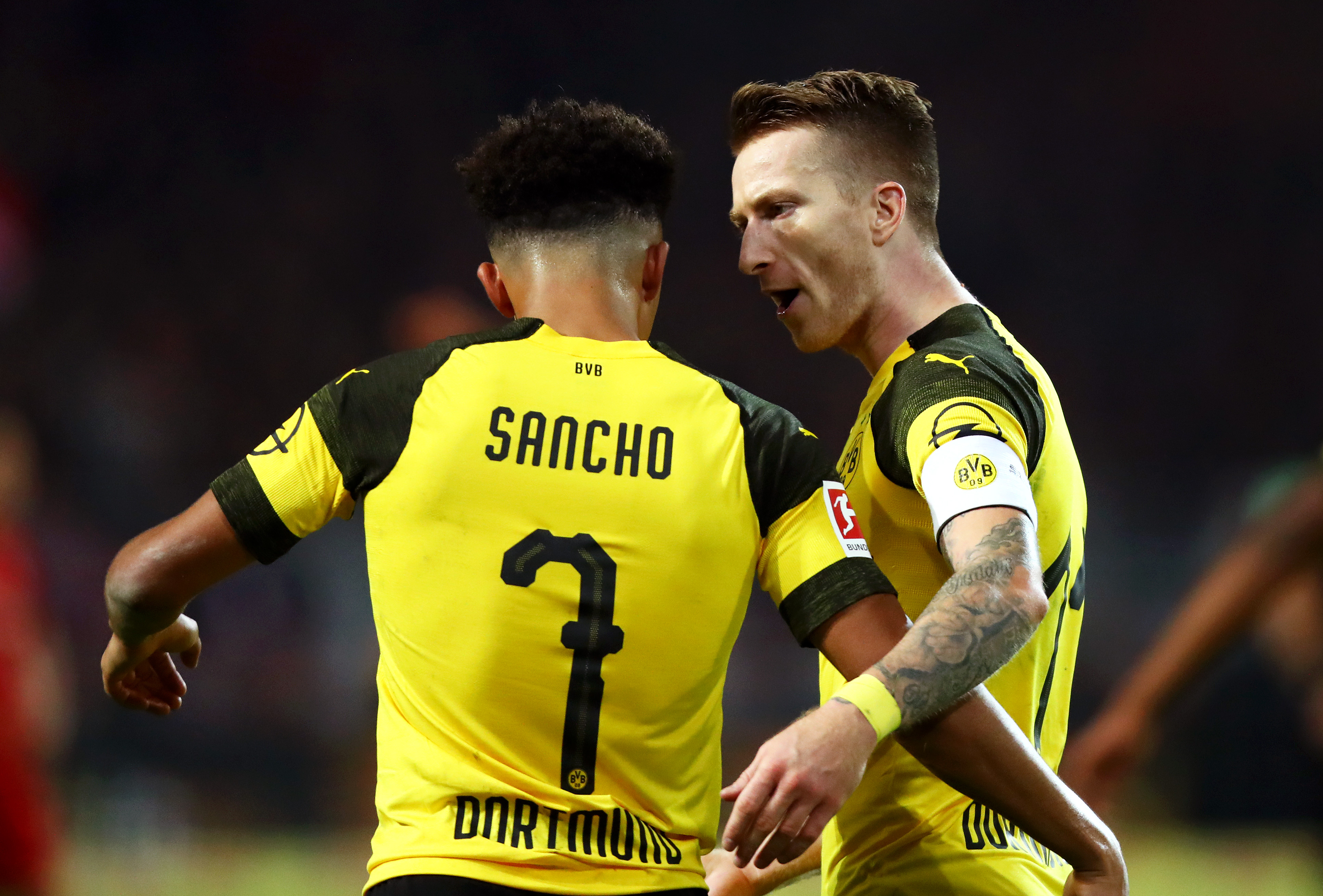 DORTMUND, GERMANY - NOVEMBER 10:  Marco Reus of Borussia Dortmund celebrates with teammate Jadon Sancho after scoring his team's second goal during the Bundesliga match between Borussia Dortmund and FC Bayern Muenchen at Signal Iduna Park on November 10, 2018 in Dortmund, Germany.  (Photo by Dean Mouhtaropoulos/Bongarts/Getty Images)