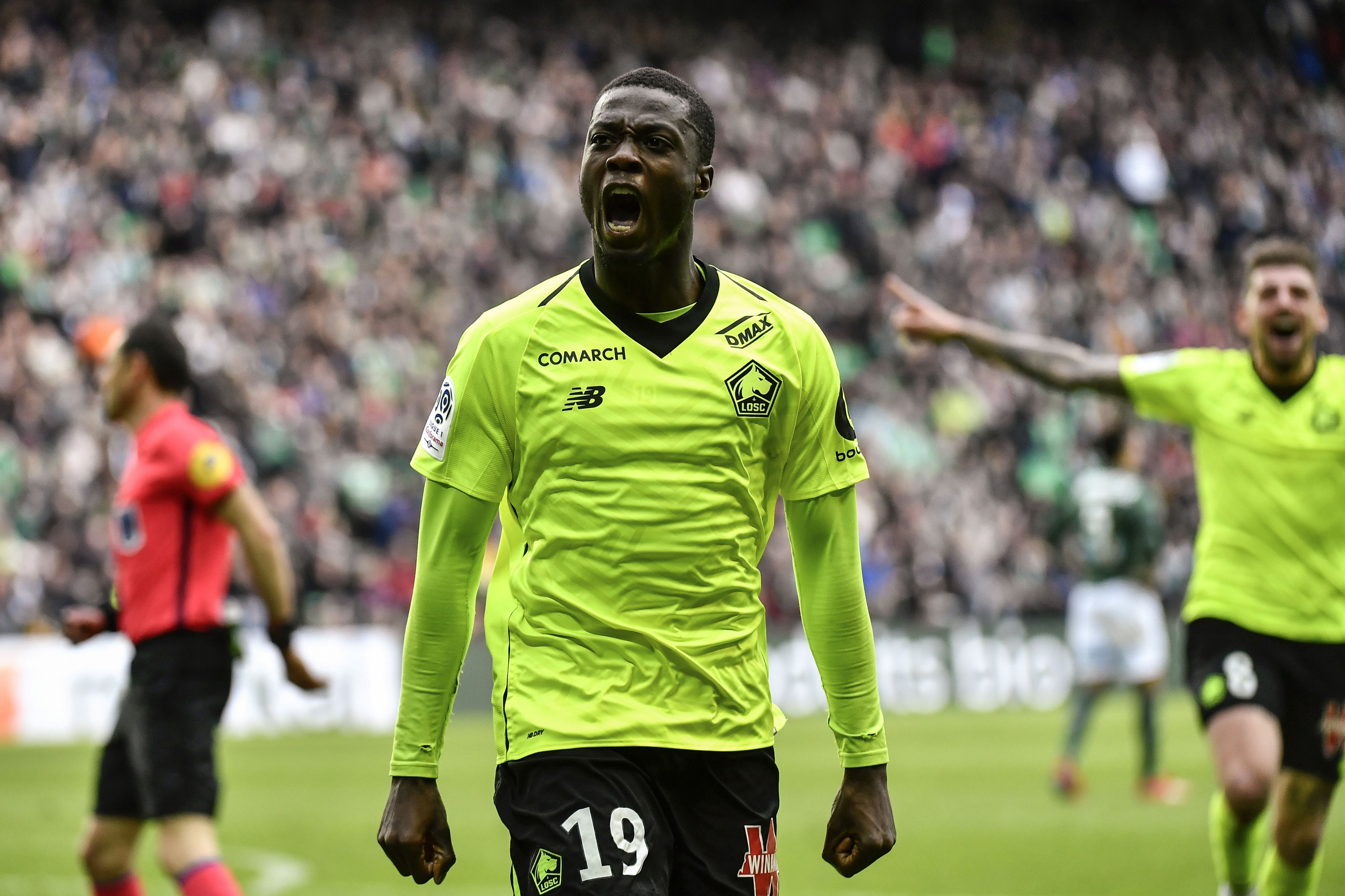 Lille's Ivorian forward Nicolas Pepe celebrates after scoring a goal during the L1 football match AS Saint-Etienne (ASSE) vs Lille (LOSC) on March 10, 2019, at the Geoffroy Guichard Stadium in Saint-Etienne, central France. (Photo by JEFF PACHOUD / AFP)        (Photo credit should read JEFF PACHOUD/AFP/Getty Images)