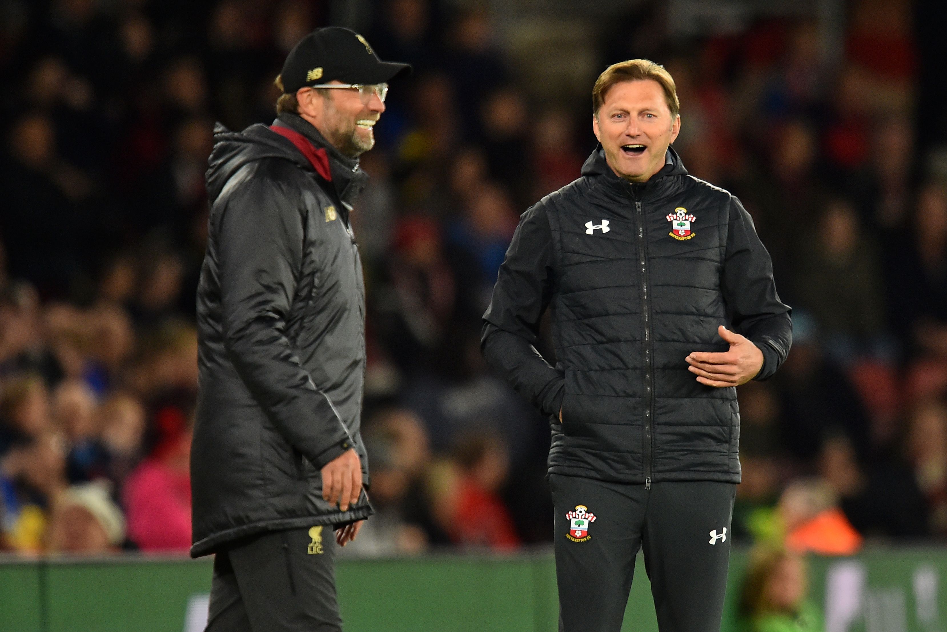 Liverpool's German manager Jurgen Klopp (L) and Southampton's Austrian manager Ralph Hasenhuttl (R) share a joke on the touchline during the English Premier League football match between Southampton and Liverpool at St Mary's Stadium in Southampton, southern England on April 5, 2019. (Photo by Glyn KIRK / AFP) / RESTRICTED TO EDITORIAL USE. No use with unauthorized audio, video, data, fixture lists, club/league logos or 'live' services. Online in-match use limited to 120 images. An additional 40 images may be used in extra time. No video emulation. Social media in-match use limited to 120 images. An additional 40 images may be used in extra time. No use in betting publications, games or single club/league/player publications. /         (Photo credit should read GLYN KIRK/AFP/Getty Images)