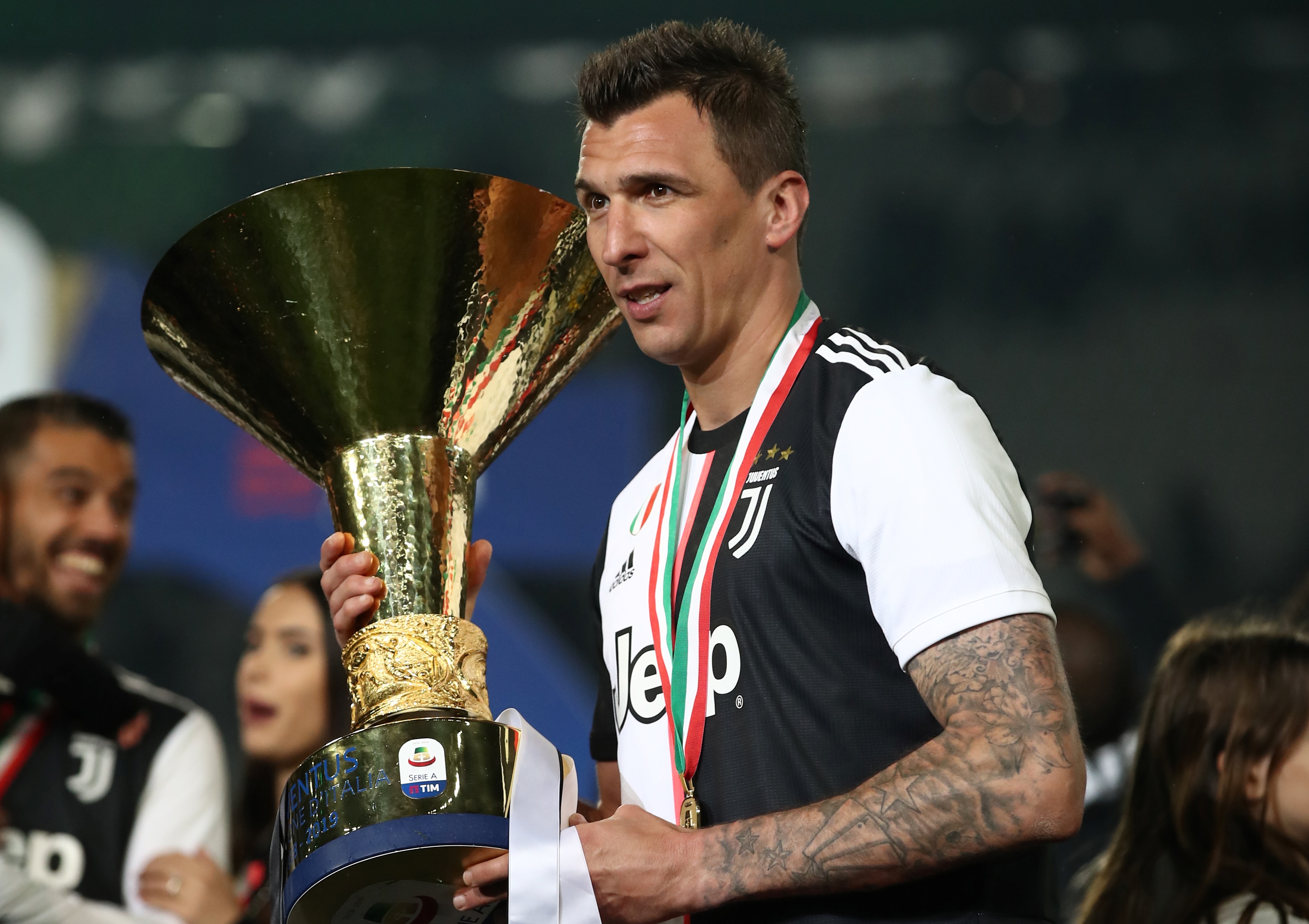 Juventus' Croatian forward Mario Mandzukic holds the Italian Champion's trophy at the end of the Italian Serie A football match Juventus vs Atalanta on May 19, 2019 at the Allianzstadium in Turin. (Photo by Isabella BONOTTO / AFP)        (Photo credit should read ISABELLA BONOTTO/AFP/Getty Images)