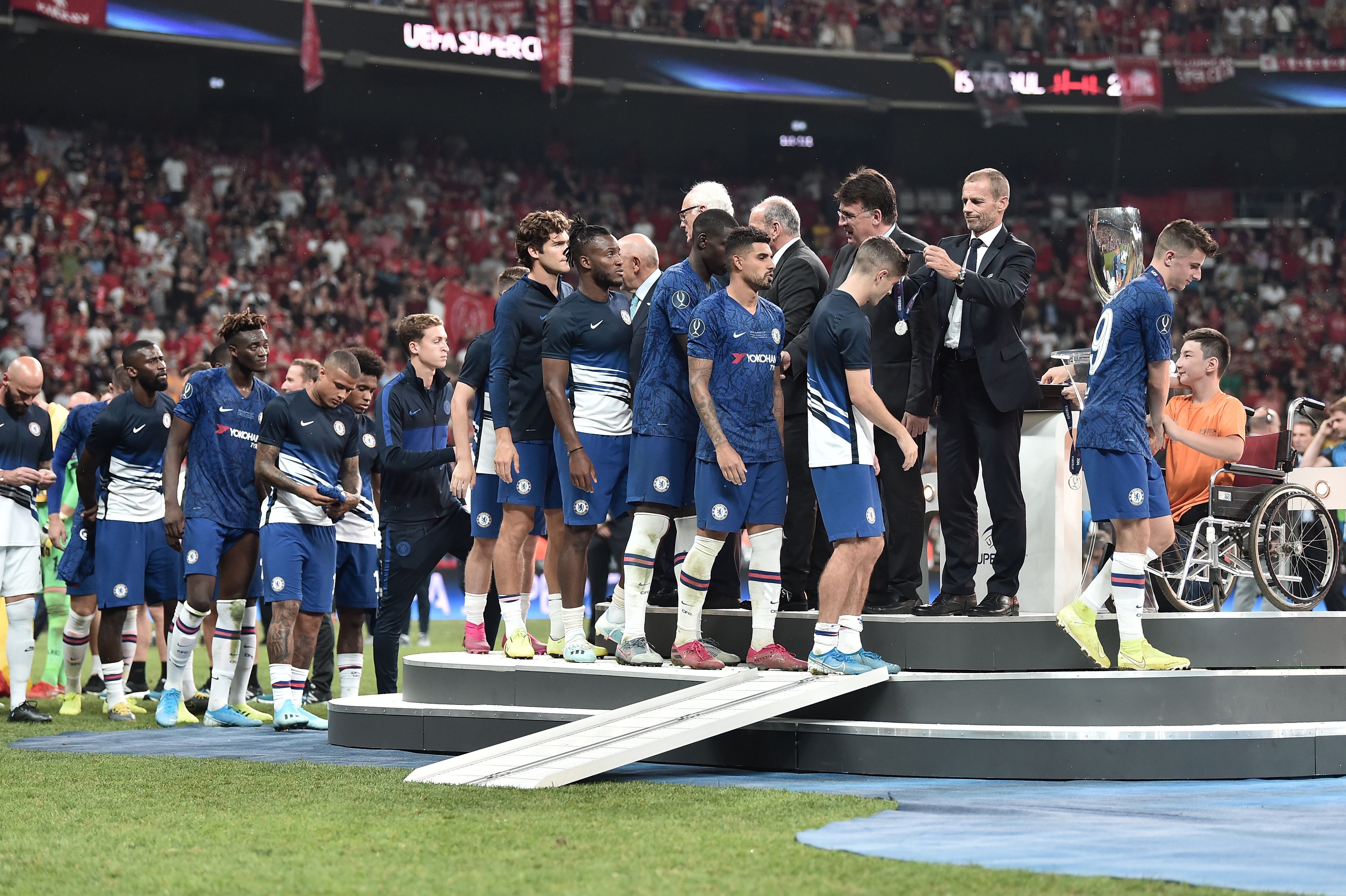 Chelsea players receive their medals after their defeat during the UEFA Super Cup 2019 football match between FC Liverpool and FC Chelsea at Besiktas Park Stadium in Istanbul on August 14, 2019. (Photo by OZAN KOSE / AFP)        (Photo credit should read OZAN KOSE/AFP/Getty Images)