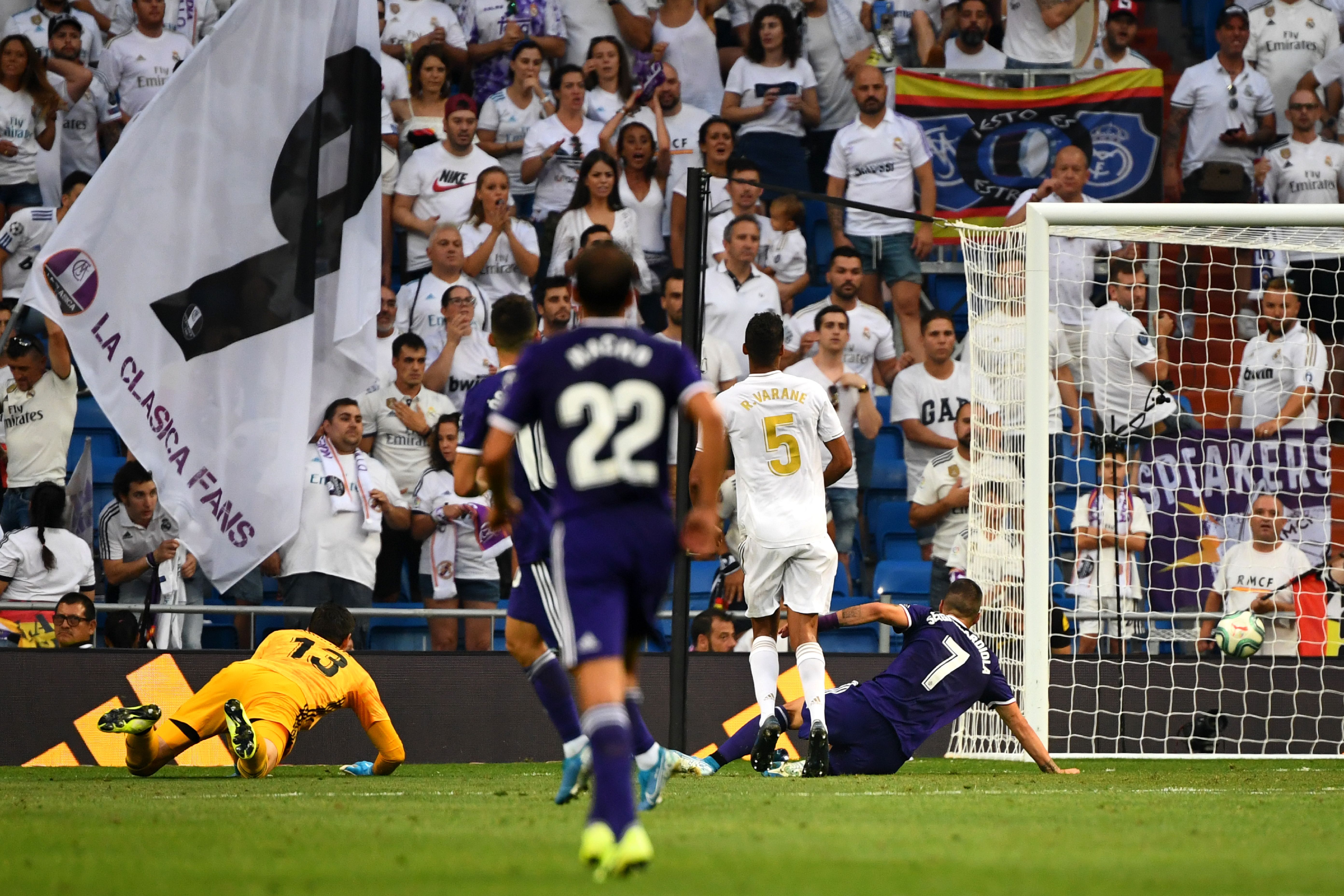 Valladolid's Spanish midfielder Sergio Guardiola (R) scores during the Spanish League football match between Real Madrid and Real Valladolid at the Santiago Bernabeu stadium in Madrid on August 24, 2019. (Photo by GABRIEL BOUYS / AFP)        (Photo credit should read GABRIEL BOUYS/AFP/Getty Images)