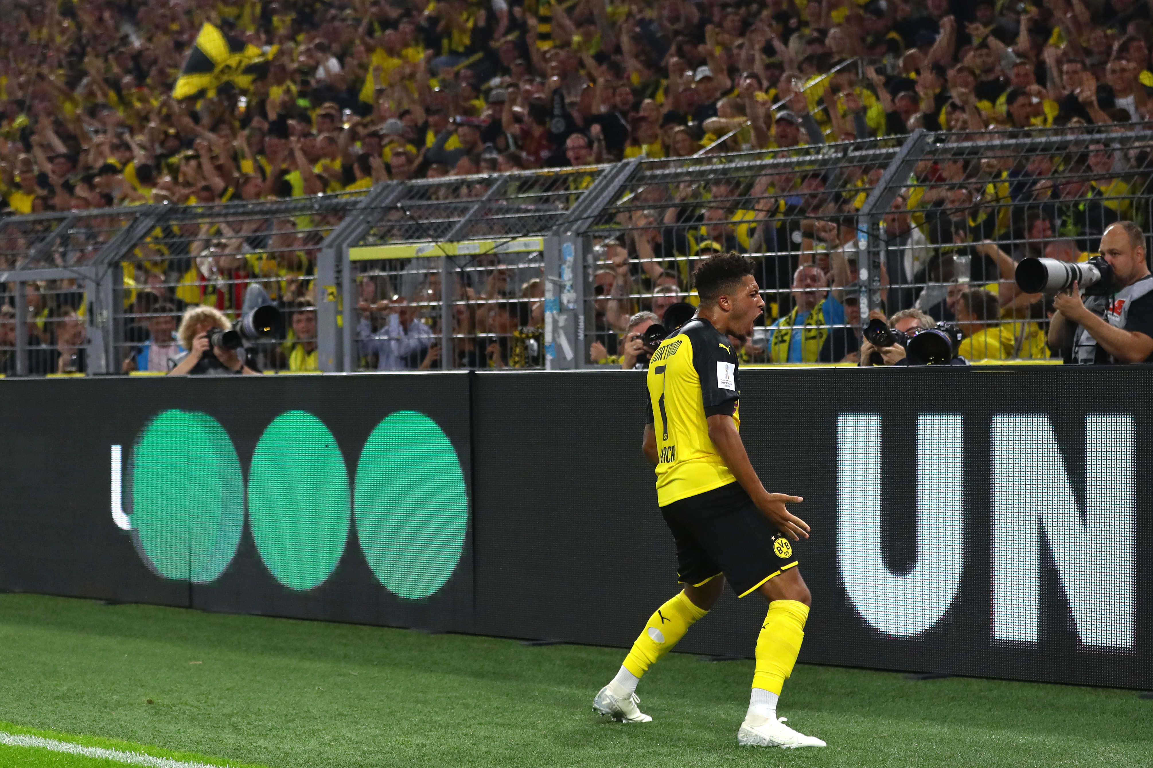 DORTMUND, GERMANY - AUGUST 03: Jadon Sancho of Borussia Dortmund celebrates after scoring his team's second goal during the DFL Supercup 2019 match between Borussia Dortmund and FC Bayern München at Signal Iduna Park on August 03, 2019 in Dortmund, Germany. (Photo by Martin Rose/Bongarts/Getty Images)