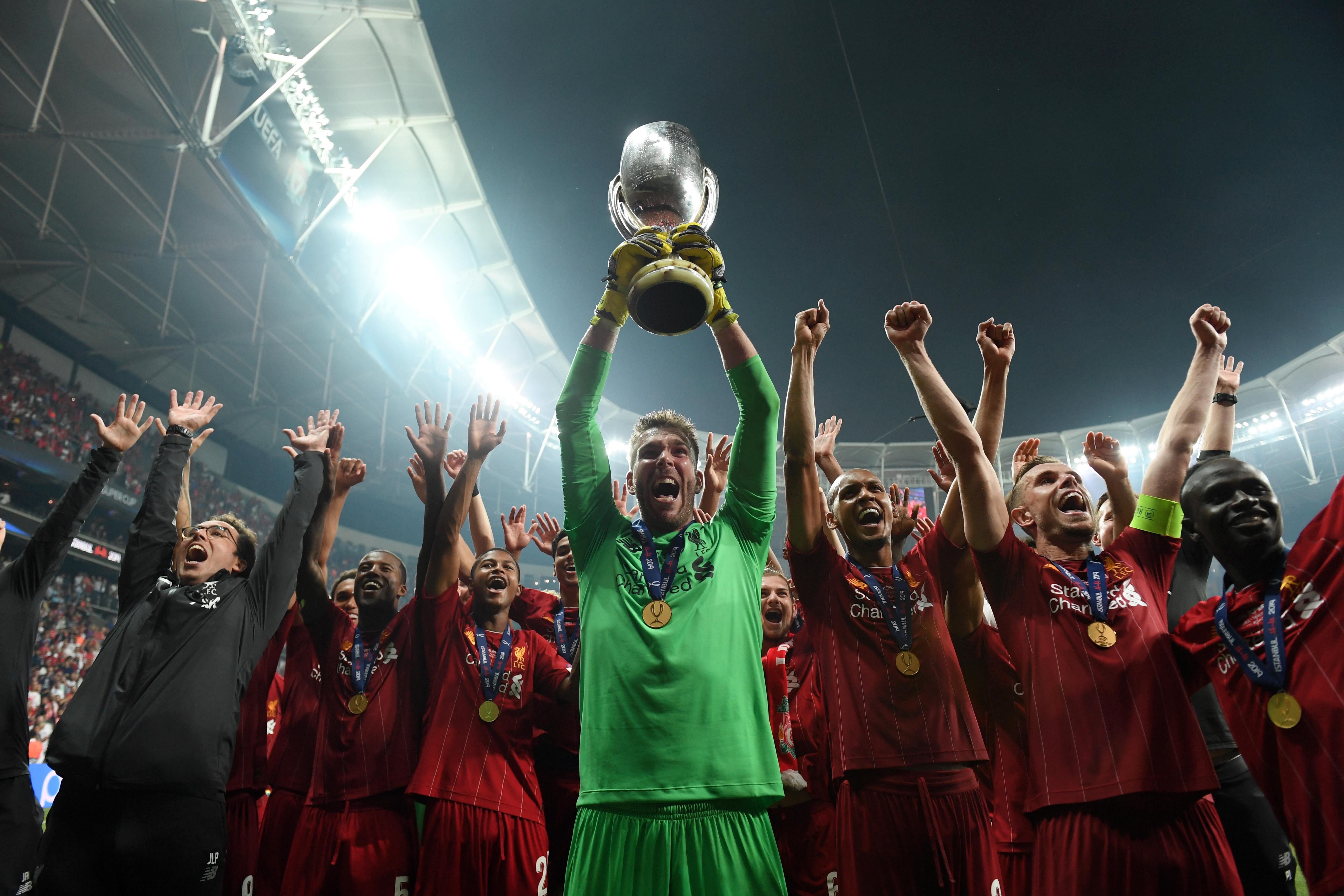 ISTANBUL, TURKEY - AUGUST 14: Adrian of Liverpool lifts the UEFA Super Cup trophy as Liverpool celebrates victory following the UEFA Super Cup match between Liverpool and Chelsea at Vodafone Park on August 14, 2019 in Istanbul, Turkey. (Photo by Michael Regan/Getty Images)