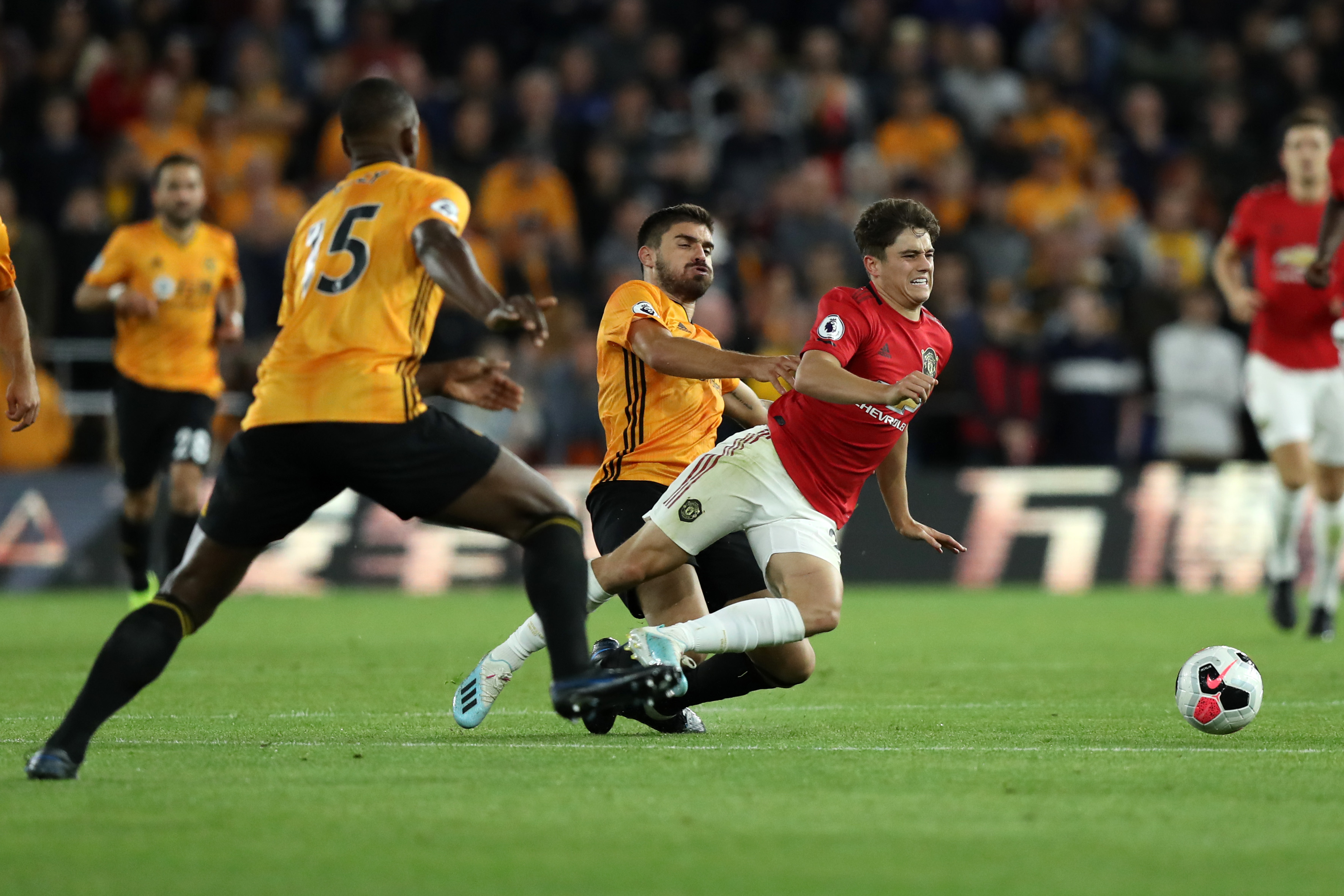 WOLVERHAMPTON, ENGLAND - AUGUST 19: Daniel James of Manchester United is tackled by Ruben Neves of Wolverhampton Wanderers during the Premier League match between Wolverhampton Wanderers and Manchester United at Molineux on August 19, 2019 in Wolverhampton, United Kingdom. (Photo by David Rogers/Getty Images)