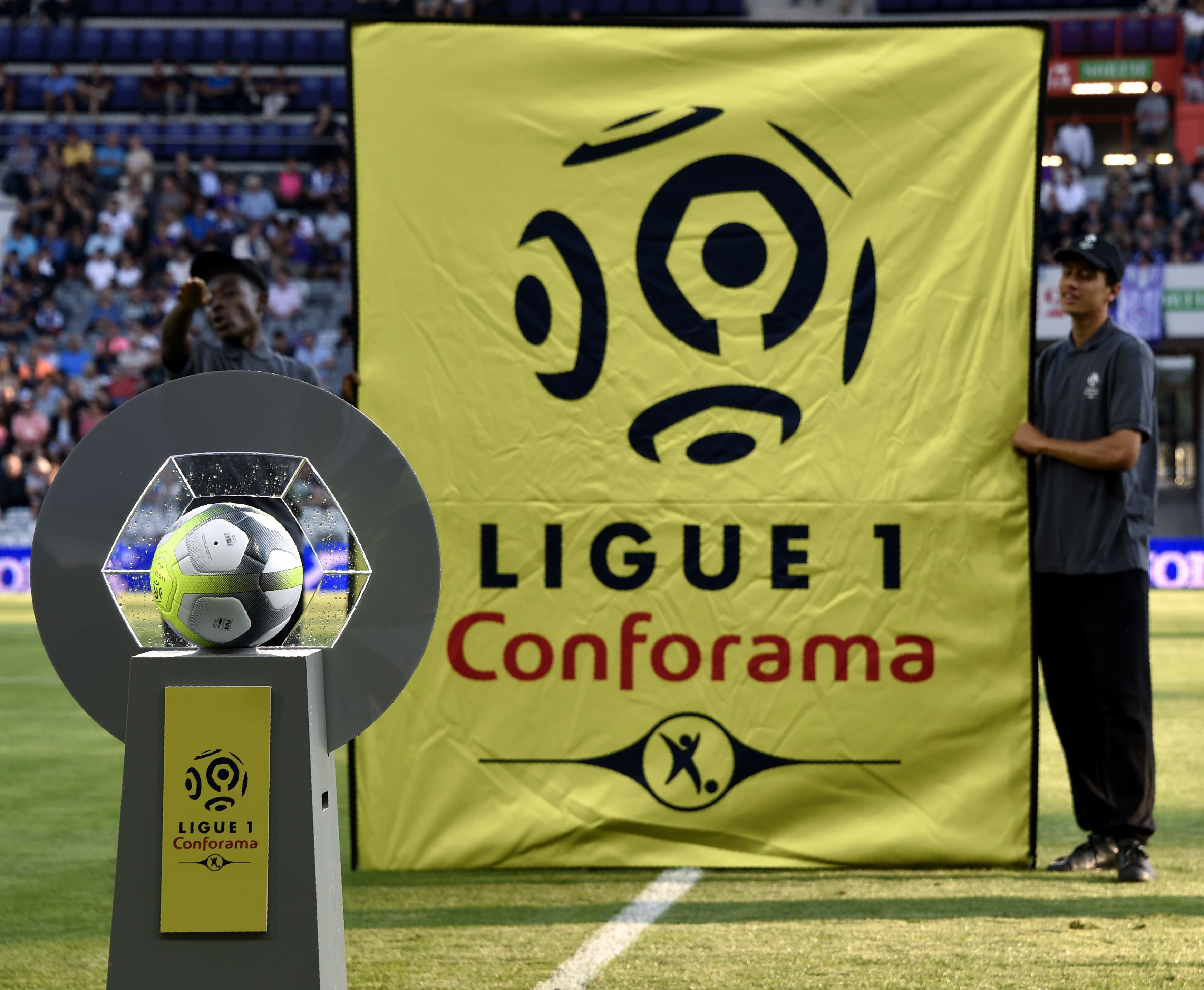 The new sponsor logo "Ligue 1 - Conforama" is installed next to the new official ball, prior to the French Ligue 1 football match between Toulouse and Montpellier at the Municipal Stadium in Toulouse, southern France, on August 12, 2017.  / AFP PHOTO / PASCAL PAVANI        (Photo credit should read PASCAL PAVANI/AFP/Getty Images)
