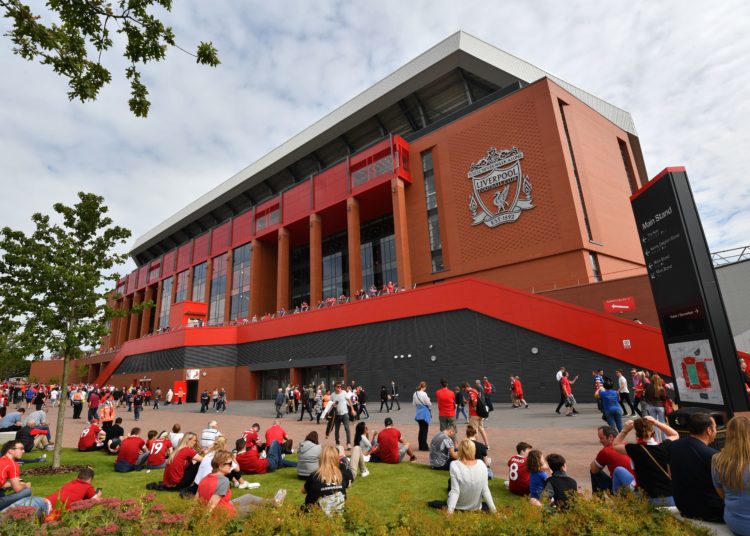 Fans gather outside the stadium in the sunshine ahead of the English Premier League football match between Liverpool and Arsenal at Anfield in Liverpool, north west England on August 27, 2017. / AFP PHOTO / Anthony DEVLIN / RESTRICTED TO EDITORIAL USE. No use with unauthorized audio, video, data, fixture lists, club/league logos or 'live' services. Online in-match use limited to 75 images, no video emulation. No use in betting, games or single club/league/player publications.  /         (Photo credit should read ANTHONY DEVLIN/AFP/Getty Images)