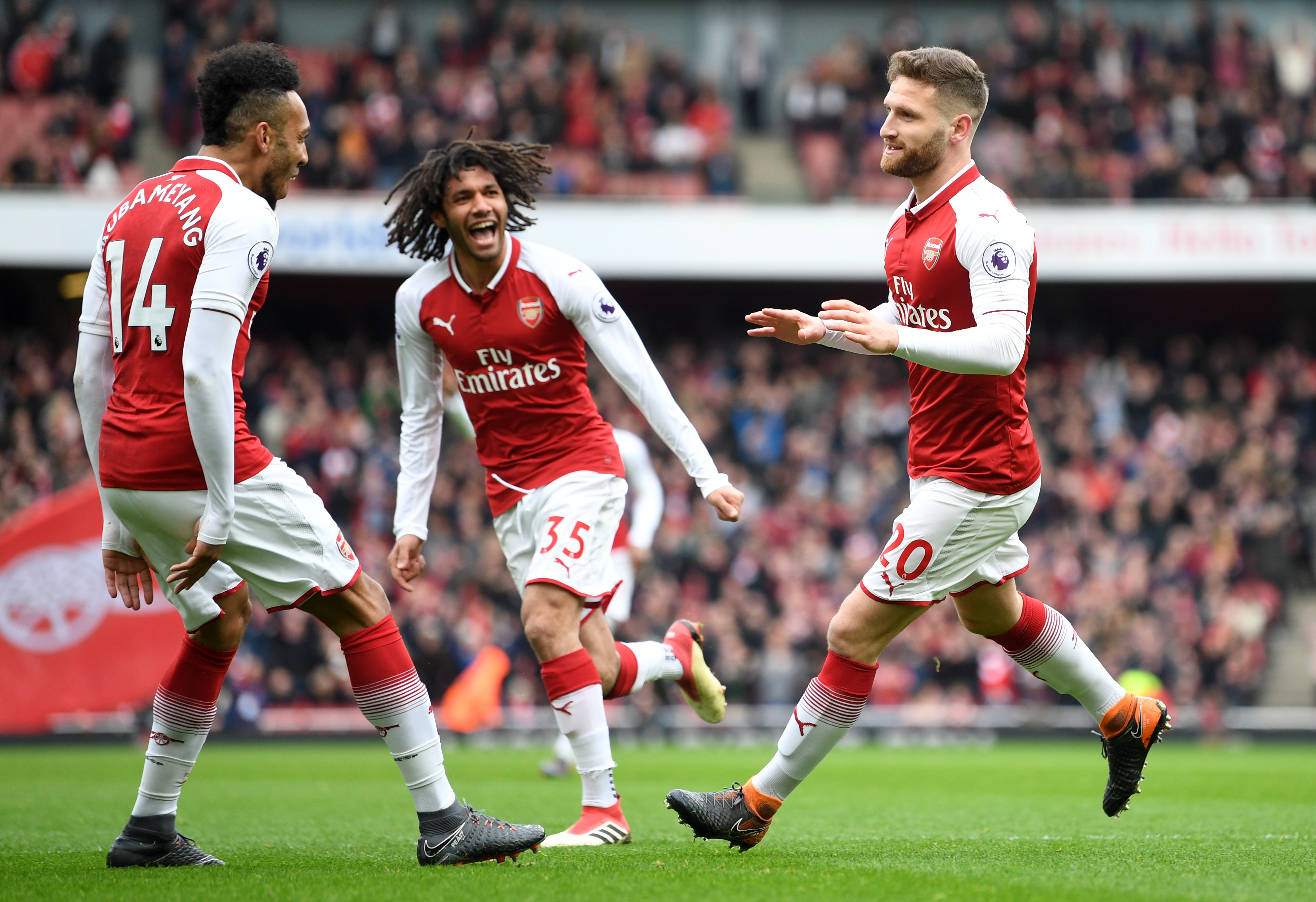 LONDON, ENGLAND - MARCH 11:  Shkodran Mustafi of Arsenal celebrates coring the first goal with Pierre-Emerick Aubameyang of Arsenal and Mohamed Elneny of Arsenal during the Premier League match between Arsenal and Watford at Emirates Stadium on March 11, 2018 in London, England.  (Photo by Michael Regan/Getty Images)