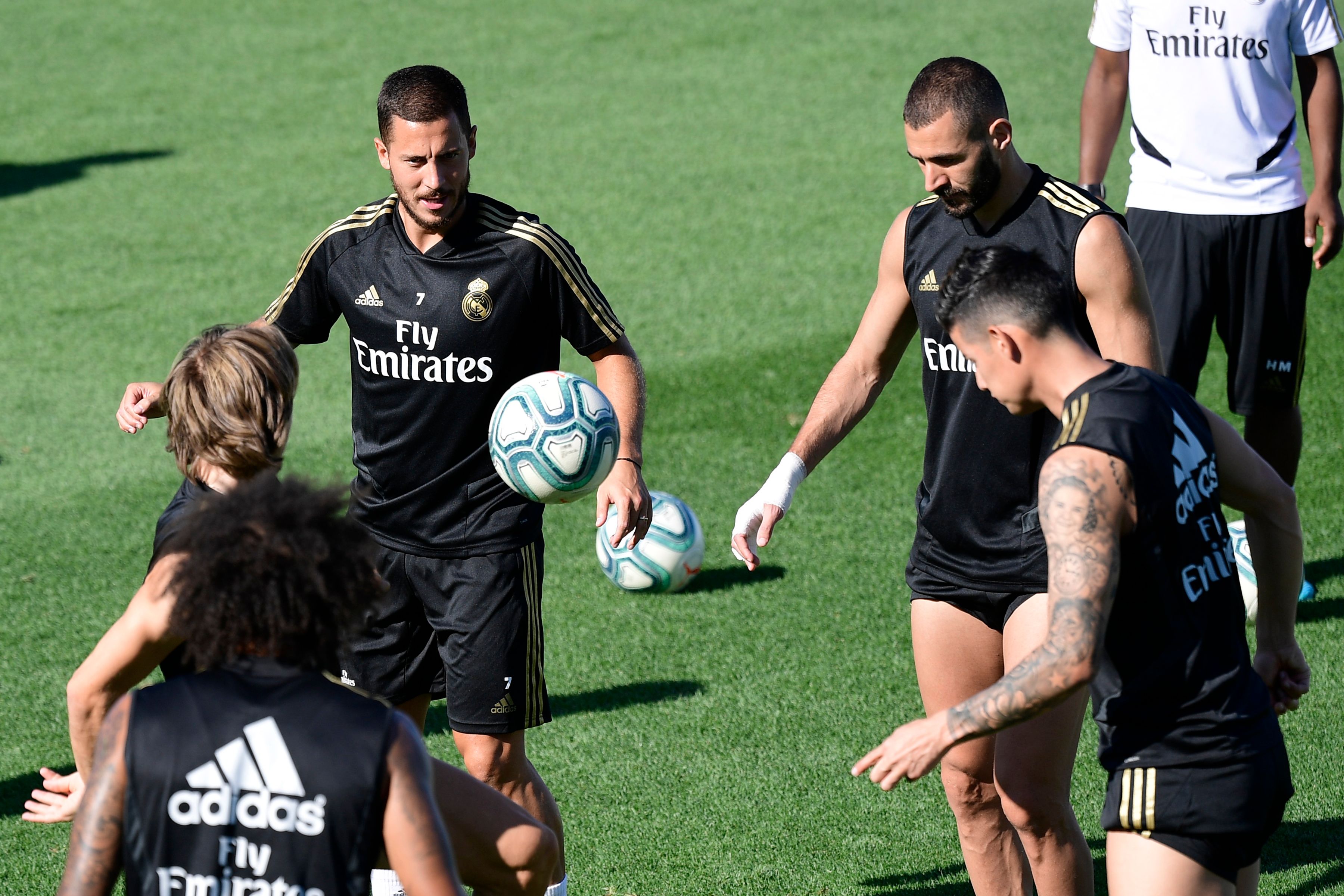 Real Madrid's Belgian forward Eden Hazard (L) and Real Madrid's French forward Karim Benzema take part in a training session at Real Madrid's sport city in Madrid on August 16, 2019. (Photo by JAVIER SORIANO / AFP)        (Photo credit should read JAVIER SORIANO/AFP/Getty Images)