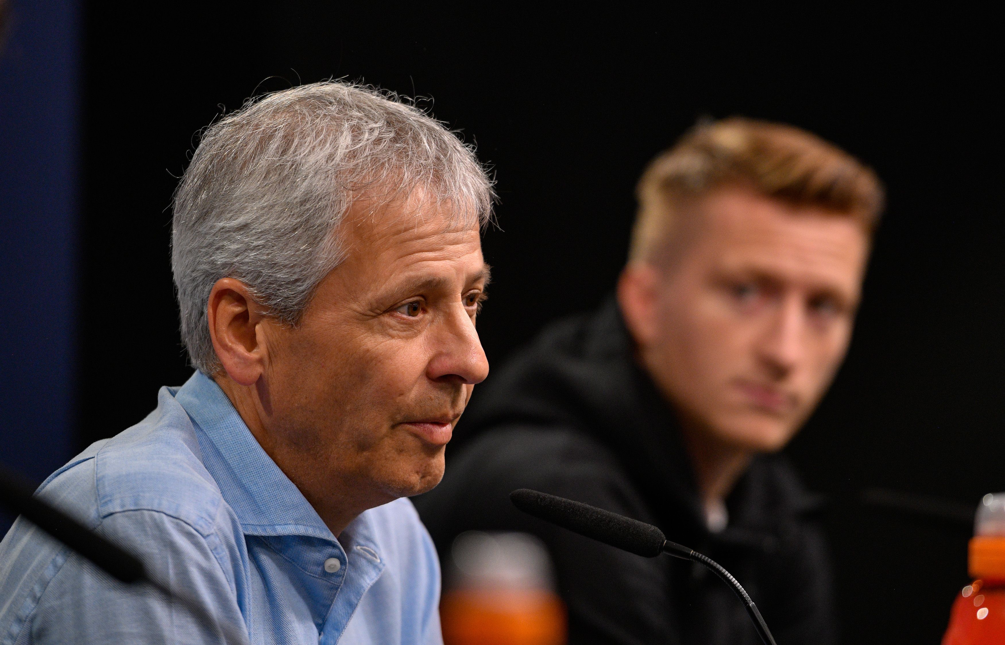 Dortmund's Swiss coach Lucien Favre and Dortmund's German forward Marco Reus are pictured during a press conference in Dortmund, western Germany, on September 16, 2019 on the eve of the UEFA Champions League Group F football match between Borussia Dortmund and Barcelona. (Photo by SASCHA SCHUERMANN / AFP)        (Photo credit should read SASCHA SCHUERMANN/AFP/Getty Images)