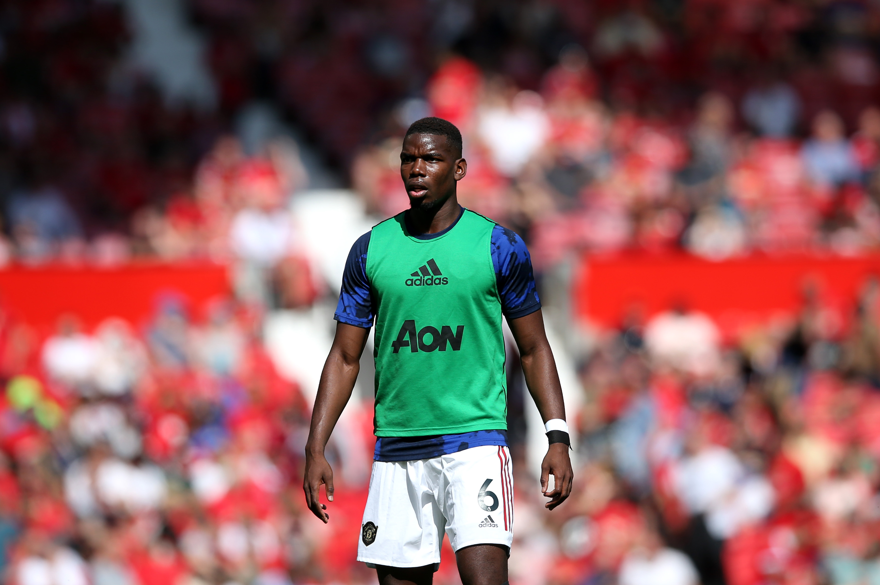 MANCHESTER, ENGLAND - AUGUST 24: Paul Pogba of Manchester United looks on prior to the Premier League match between Manchester United and Crystal Palace at Old Trafford on August 24, 2019 in Manchester, United Kingdom. (Photo by Jan Kruger/Getty Images)
