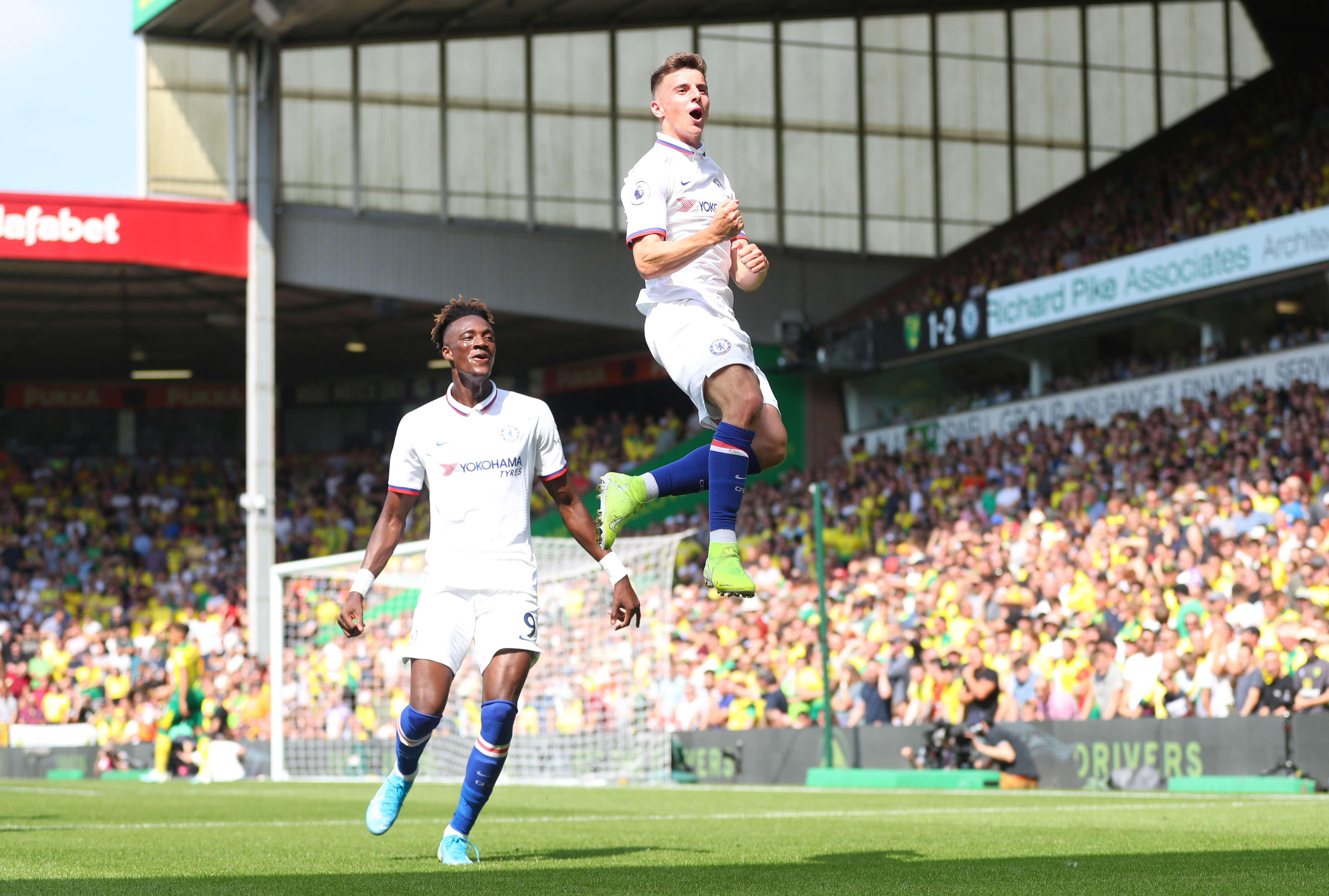 NORWICH, ENGLAND - AUGUST 24: Mason Mount of Chelsea celebrates scoring his teams second goal with Tammy Abraham during the Premier League match between Norwich City and Chelsea FC at Carrow Road on August 24, 2019 in Norwich, United Kingdom. (Photo by Catherine Ivill/Getty Images)