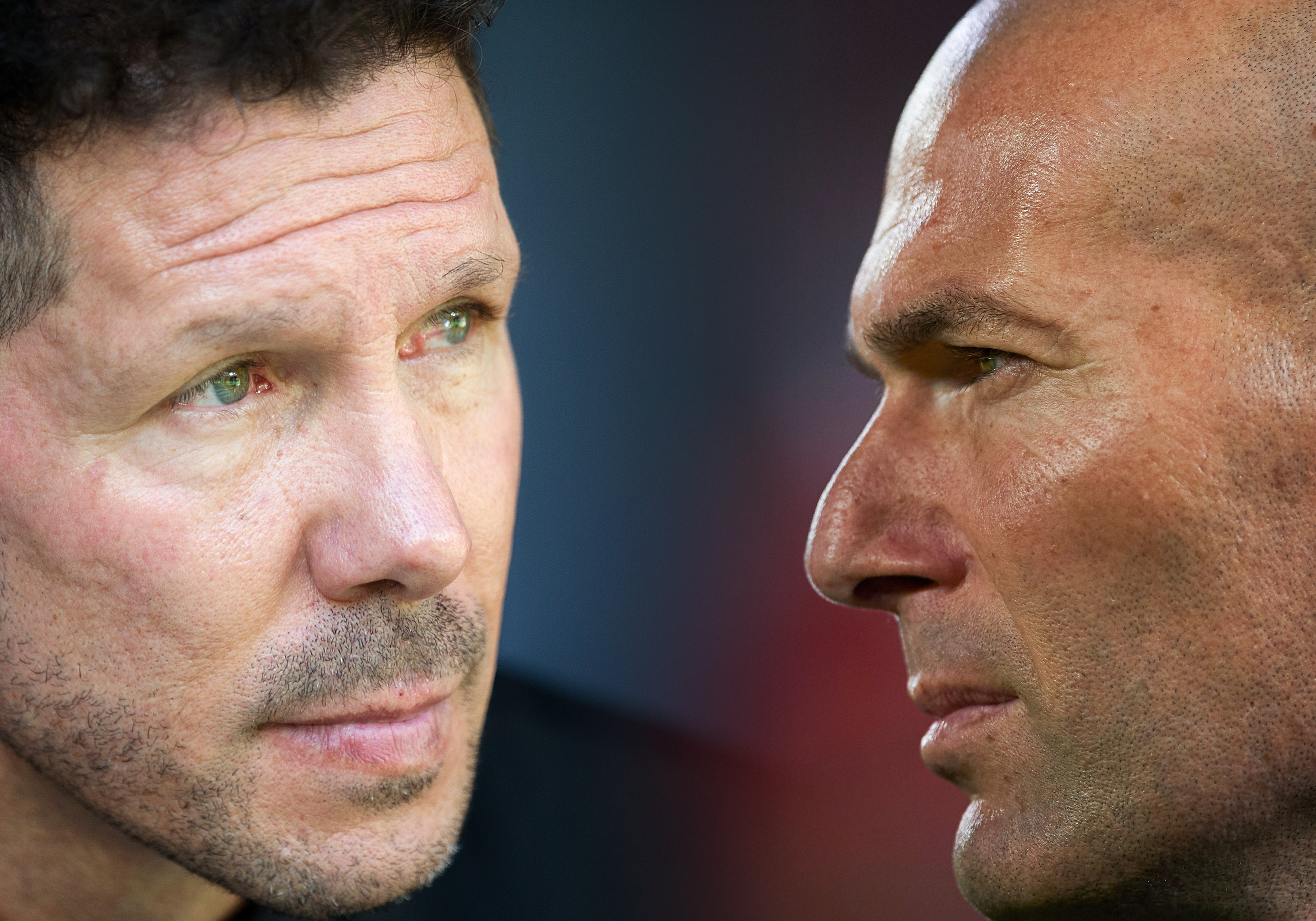 FILE PHOTO (EDITORS NOTE: COMPOSITE OF IMAGES - Image numbers 852372342,956612460 - GRADIENT ADDED) In this composite image a comparison has been made between Manager Diego Simeone of Club Atletico de Madrid (L) and Head coach Zinedine Zidane of Real Madrid. The Madrid derby takes place on September 28, 2019 at the Wanda Metropolitano stadium in Madrid,Spain.  ***LEFT IMAGE*** MADRID, SPAIN - SEPTEMBER 23: Manager Diego Simeone of Club Atletico de Madrid looks on during the La Liga match between Atletico Madrid and Sevilla at Wanda Metropolitano on September 23, 2017 in Madrid, Spain. (Photo by Denis Doyle/Getty Images) ***RIGHT IMAGE***  SEVILLE, SPAIN - MAY 09: Head coach Zinedine Zidane of Real Madrid looks on prior to the start the La Liga match between Sevilla FC and Real Madrid at Ramon Sanchez Pizjuan stadium on May 9, 2018 in Seville, Spain. (Photo by Aitor Alcalde/Getty Images)