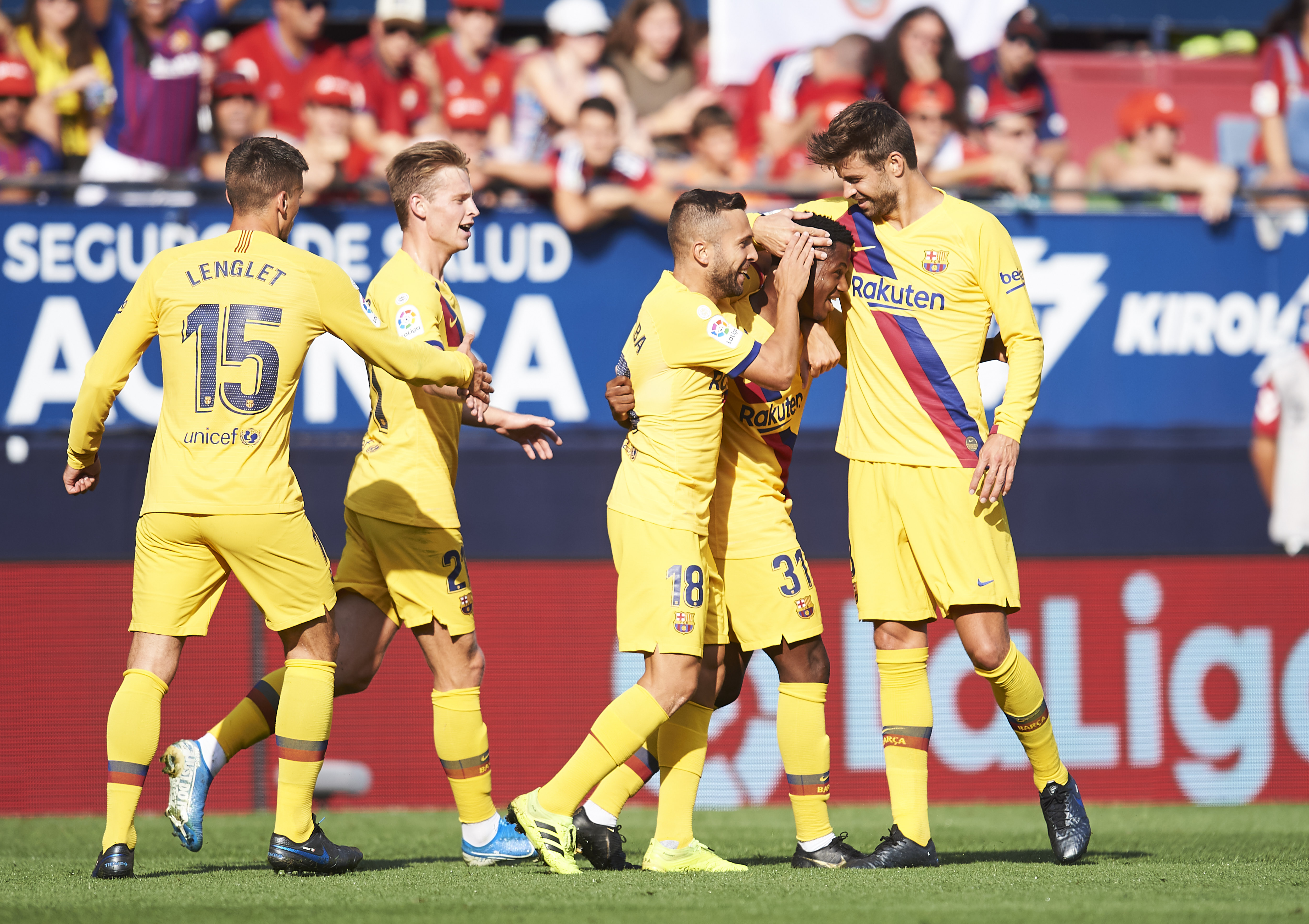 PAMPLONA, SPAIN - AUGUST 31: Anssumane Fati of FC Barcelona celebrates with teammates Jordi Alba and Gerard Pique after scoring the first goal of his team during the Liga match between CA Osasuna and FC Barcelona at Estadio Reyno de Navarra on August 31, 2019 in Pamplona, Spain. (Photo by Juan Manuel Serrano Arce/Getty Images)