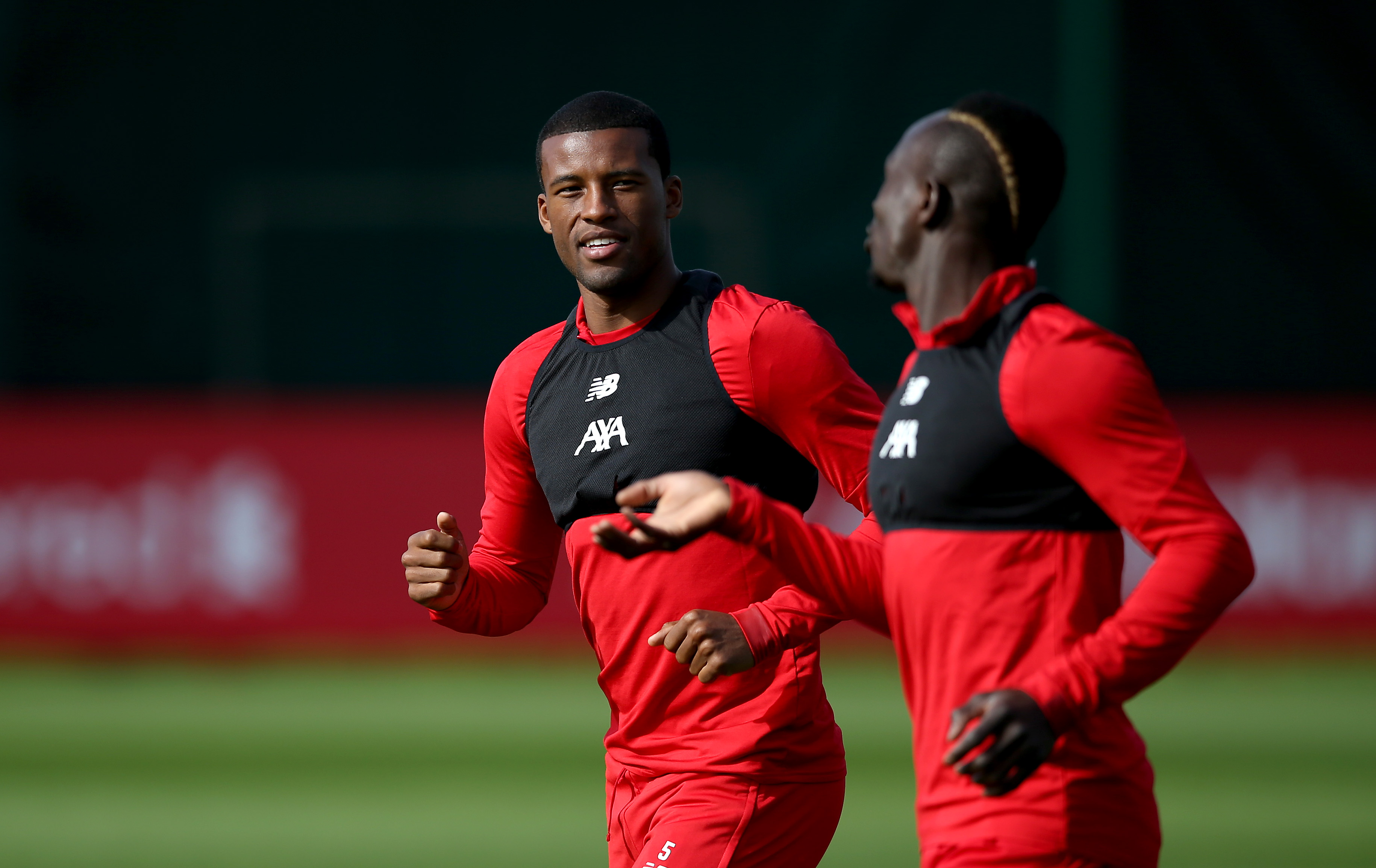 LIVERPOOL, ENGLAND - SEPTEMBER 16: Georginio Wijnaldum of Liverpool speaks to Sadio Mane of Liverpool during the Liverpool FC training session on the eve of the UEFA Champions League match between SSC Napoli and Liverpool FC at Melwood Training Ground on September 16, 2019 in Liverpool, England. (Photo by Jan Kruger/Getty Images)