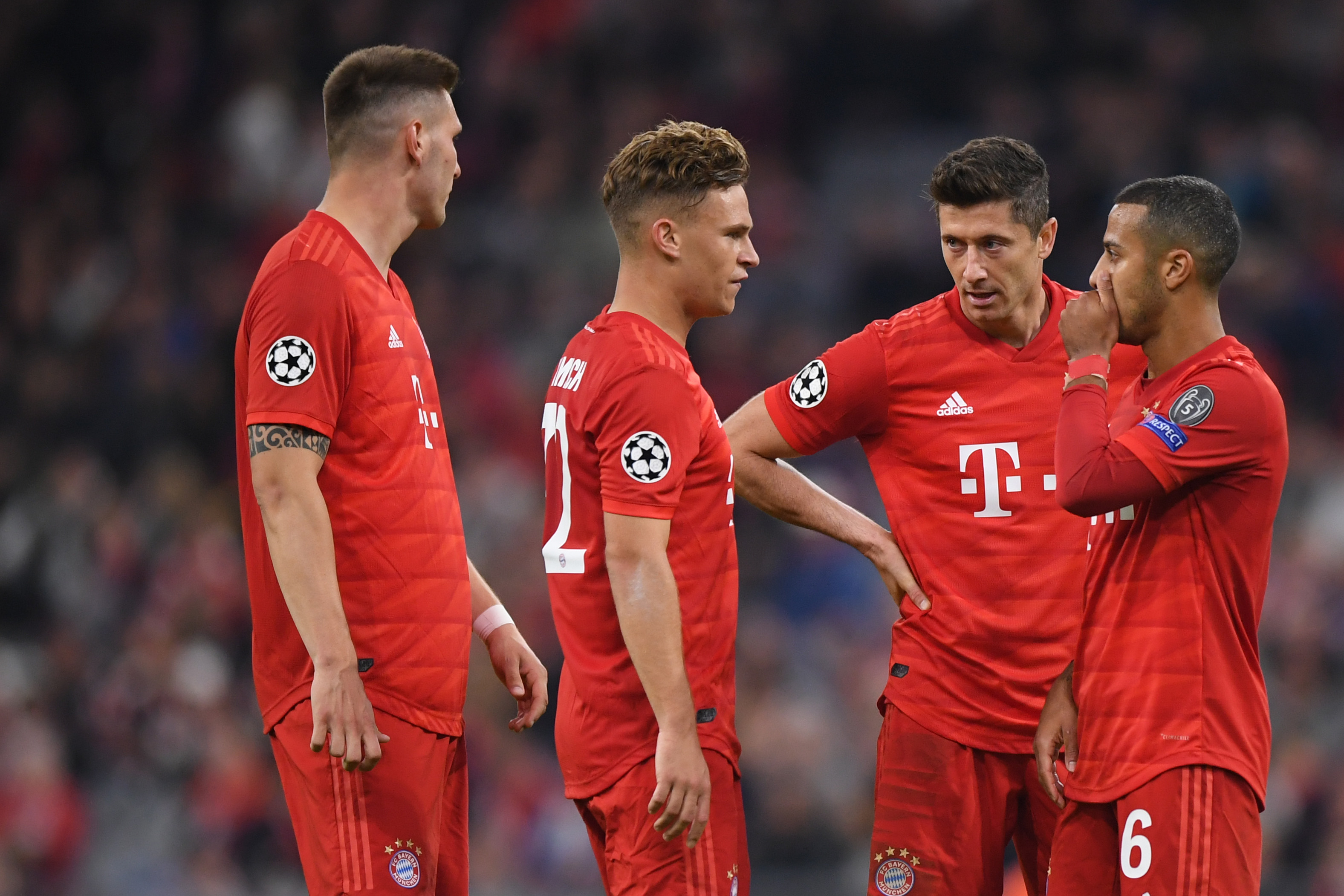 MUNICH, GERMANY - SEPTEMBER 18: Niklas Suele (l-r), Joshua Kimmich, Robert Lewandowski and Thiago Alcantara of Bayern Munich talk during the UEFA Champions League group B match between Bayern Muenchen and Crvena Zvezda at Allianz Arena on September 18, 2019 in Munich, Germany. (Photo by Sebastian Widmann/Bongarts/Getty Images)