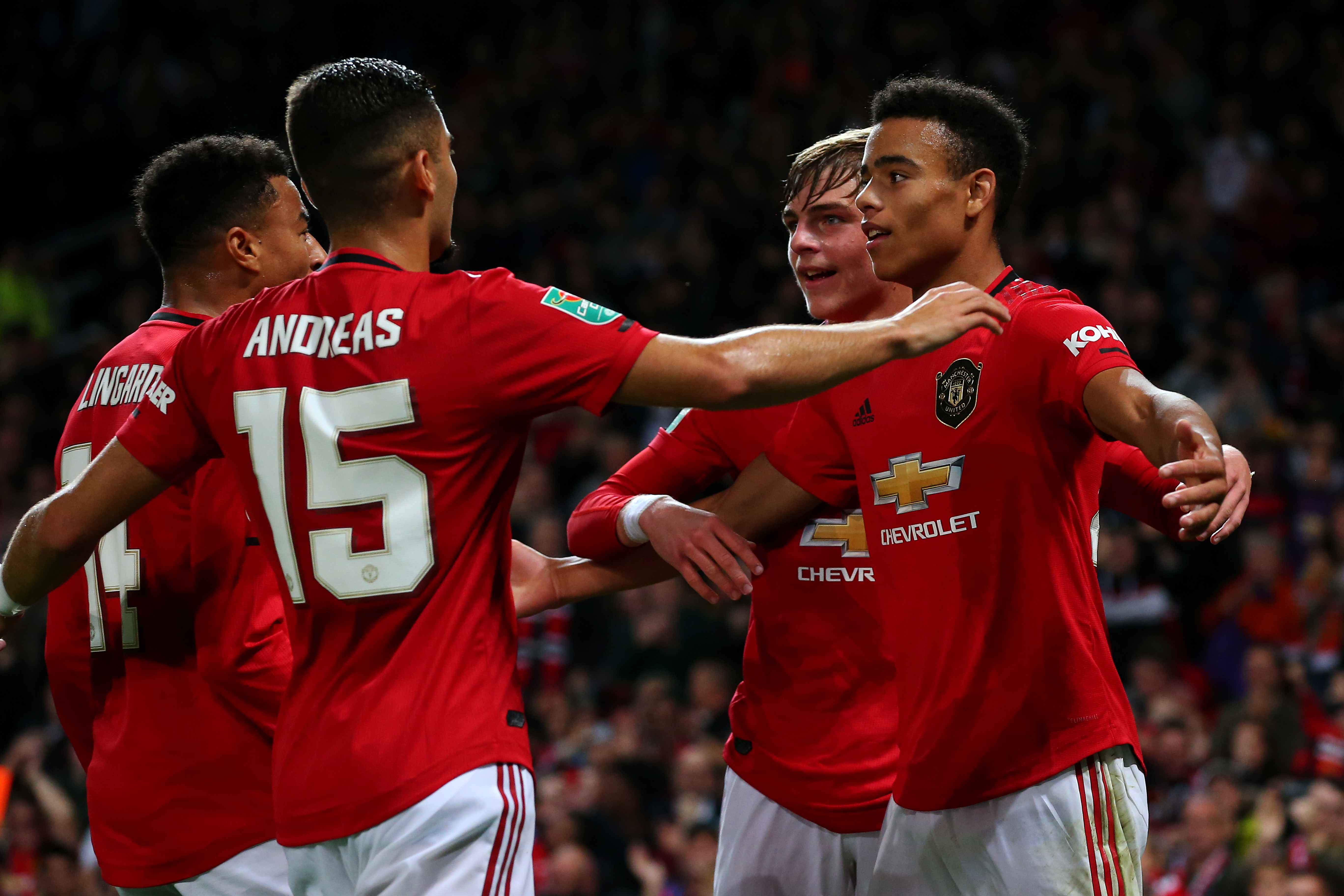 MANCHESTER, ENGLAND - SEPTEMBER 25:  Mason Greenwood of Manchester United celebrates scoring his teams first goal of the game with team mate Brandon Williams during the Carabao Cup Third Round match between Manchester United and Rochdale AFC at Old Trafford on September 25, 2019 in Manchester, England. (Photo by Alex Livesey/Getty Images)