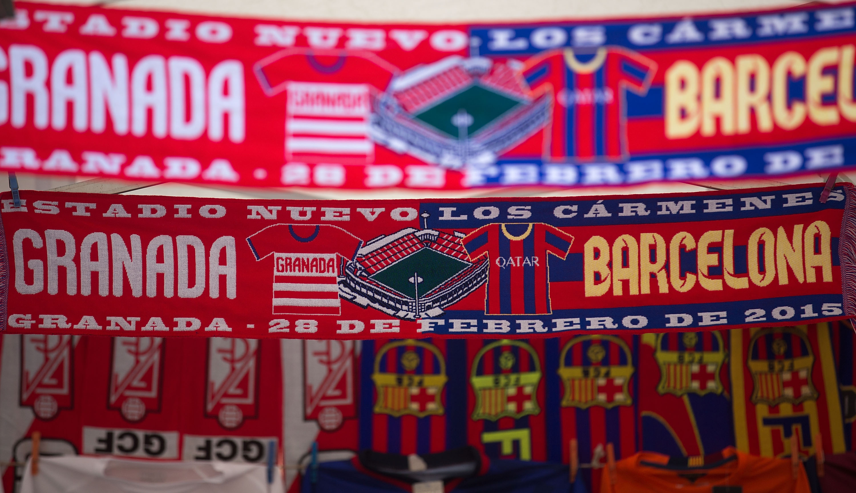 GRANADA, SPAIN - FEBRUARY 28: The Match,s scarf  is displayed at a merchandaising stall outside Nuevo Estadio de los Carmenes before the La Liga match between Granada CF and FC Barcelona on February 28, 2015 in Granada, Spain.  (Photo by Gonzalo Arroyo Moreno/Getty Images)