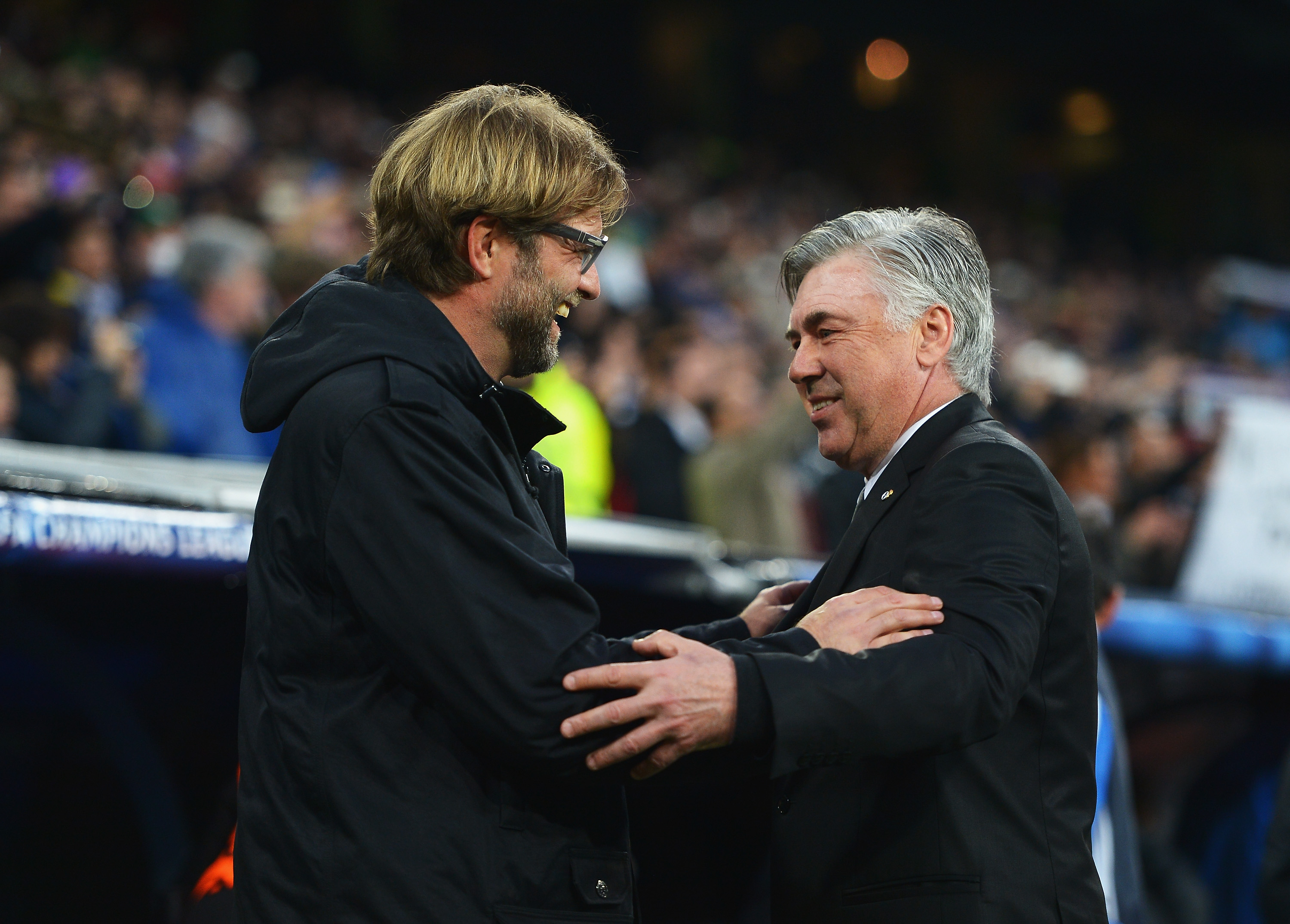 MADRID, SPAIN - APRIL 02:  Juergen Klopp (L), coach of Borussia Dortmund is greeted by Carlo Ancelotti, coach of Real Madrid during the UEFA Champions League Quarter Final first leg match between Real Madrid and Borussia Dortmund at Estadio Santiago Bernabeu on April 2, 2014 in Madrid, Spain.  (Photo by Dennis Grombkowski/Bongarts/Getty Images)