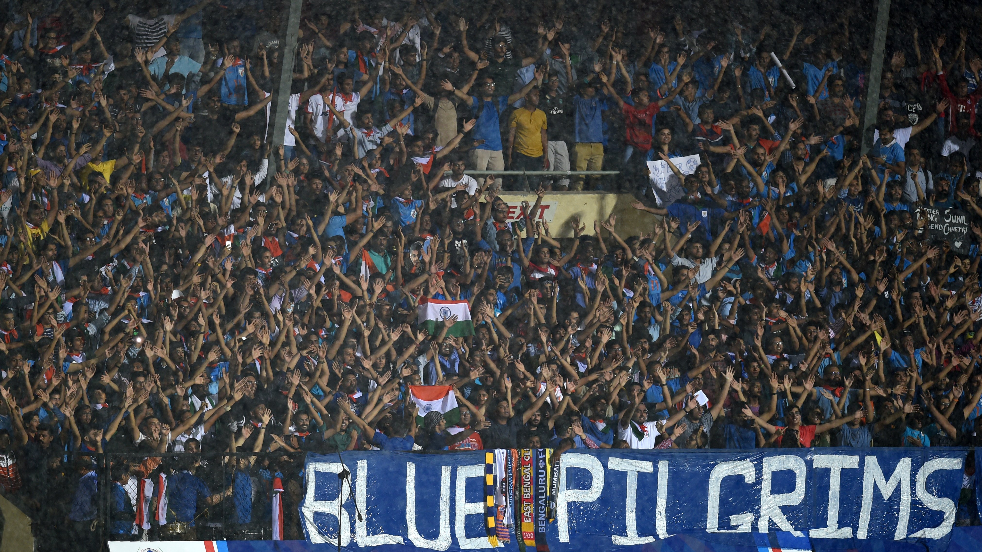 Indian fans attend the Hero Intercontinental Cup football match between India and Kenya in Mumbai on June 4, 2018. - India's football international against Kenya on June 4  was sold out in hours following captain Sunil Chhetri's emotional plea for fans to support the team after barely 2,500 people turned up to watch them play last week. (Photo by PUNIT PARANJPE / AFP)        (Photo credit should read PUNIT PARANJPE/AFP/Getty Images)
