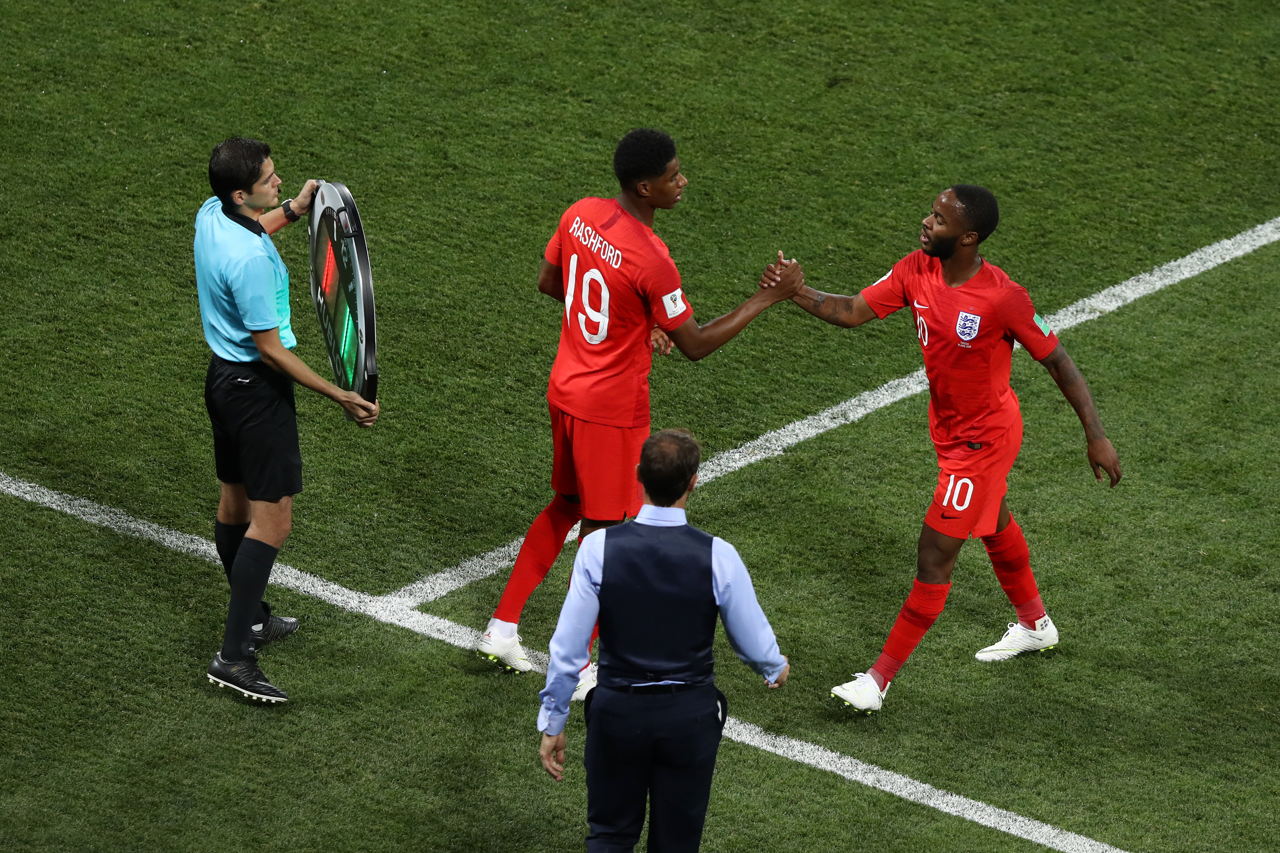 VOLGOGRAD, RUSSIA - JUNE 18:  Raheem Sterling of England greets Marcus Rashford of England as he is substituted off and Marcus Rashford is substituted on during the 2018 FIFA World Cup Russia group G match between Tunisia and England at Volgograd Arena on June 18, 2018 in Volgograd, Russia.  (Photo by Ryan Pierse/Getty Images)