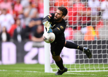 Could Alisson be back in action against Leicester City? (Photo by Laurence Griffiths/Getty Images)