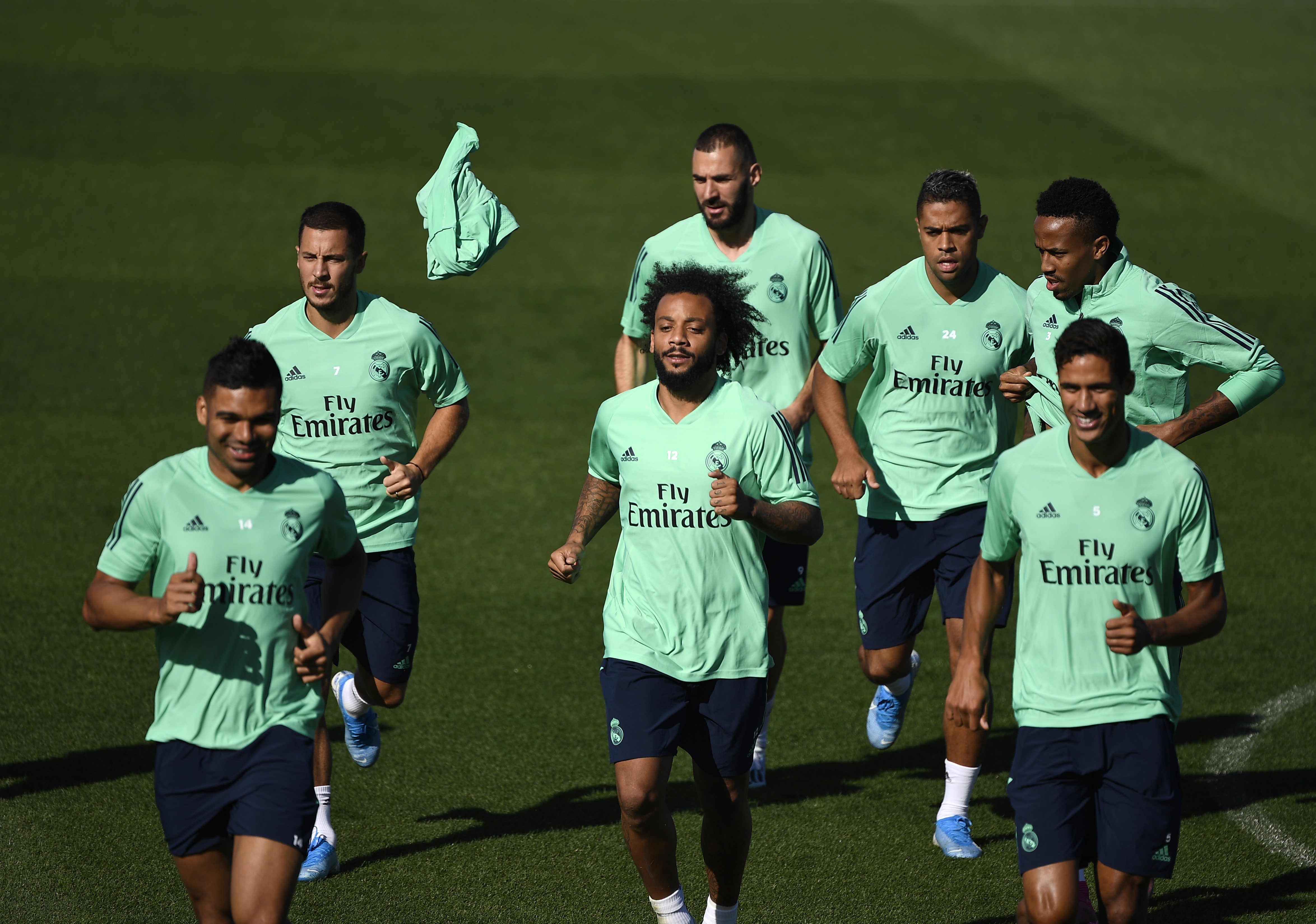 (FromL) Real Madrid's Brazilian midfielder Casemiro, Real Madrid's Belgian forward Eden Hazard, Real Madrid's Brazilian defender Marcelo, Real Madrid's French forward Karim Benzema, Real Madrid's Dominicans forward Mariano Diaz Real Madrid's Brazilian defender Eder Militao and Real Madrid's French defender Raphael Varane run during a training session at the Valdebebas training complex in the outskirts of Madrid, on September 30, 2019, on the eve of the UEFA Champions league Group A football match against Club Brugge. (Photo by PIERRE-PHILIPPE MARCOU / AFP)        (Photo credit should read PIERRE-PHILIPPE MARCOU/AFP/Getty Images)