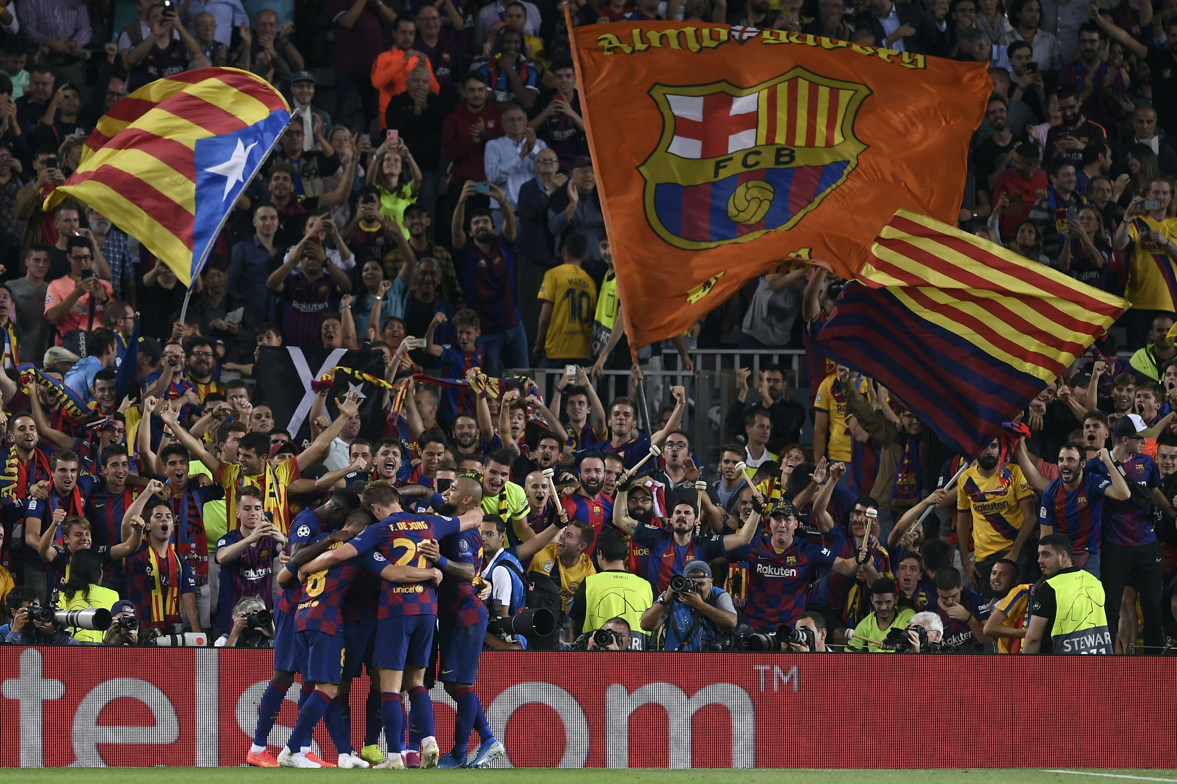 Barcelona players celebrate their second goal scored by Barcelona's Uruguayan forward Luis Suarez during the UEFA Champions League Group F football match between Barcelona and Inter Milan at the Camp Nou stadium in Barcelona, on October 2, 2019. (Photo by Josep LAGO / AFP) (Photo by JOSEP LAGO/AFP via Getty Images)