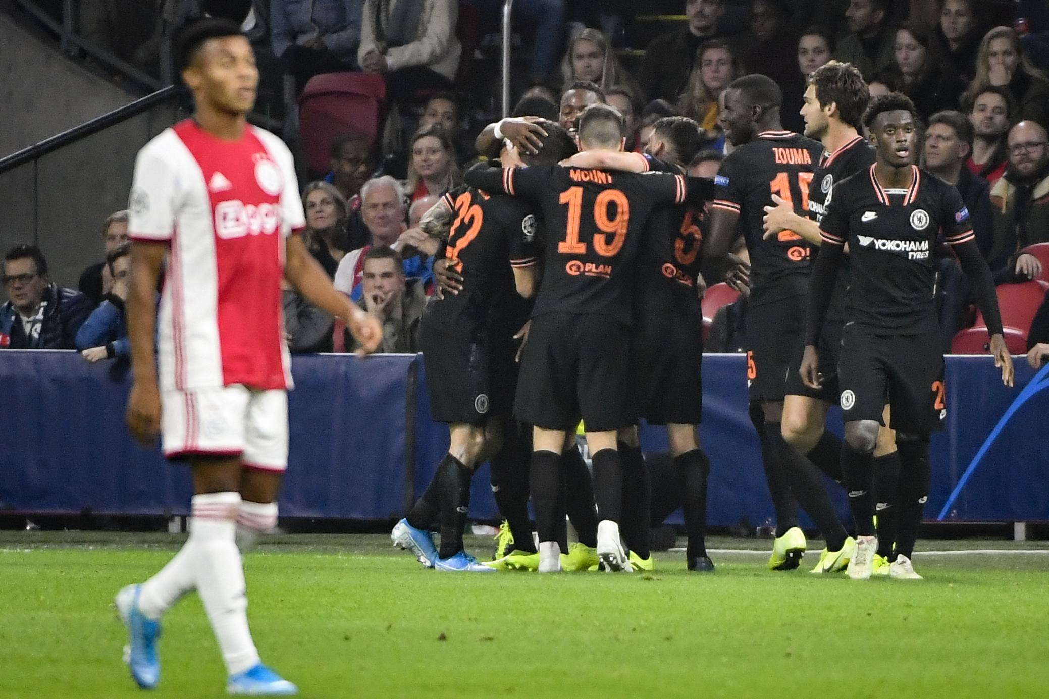 Chelsea's Belgian striker Michy Batshuayi celebrates with teammates after scoring a goal during the UEFA Champions League Group H football match between Ajax Amsterdam and Chelsea on October 23, 2019 at the Johan Cruijff Arena, in Amsterdam. (Photo by John THYS / AFP) (Photo by JOHN THYS/AFP via Getty Images)