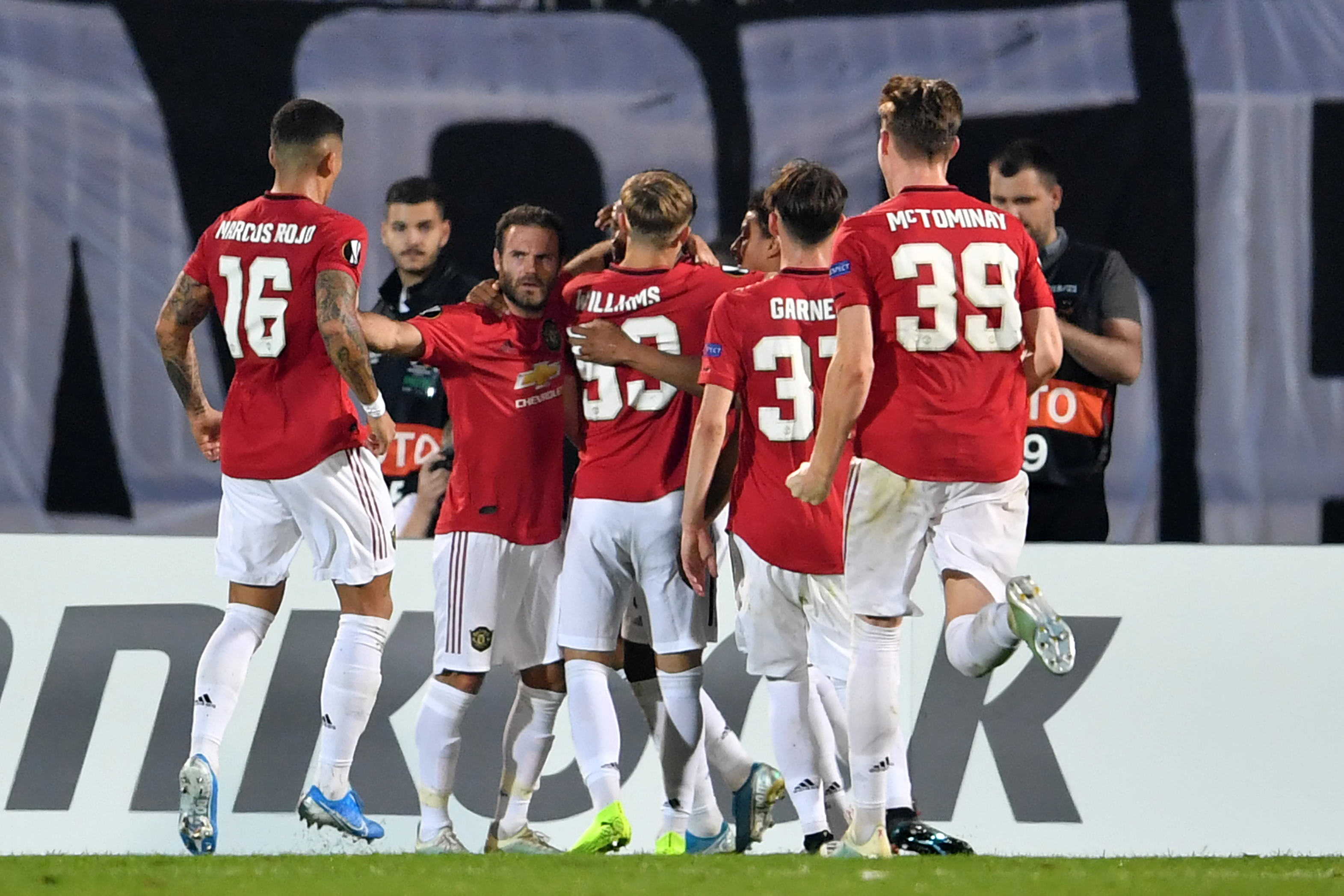 Manchester United's French striker Anthony Martial celebrates with teammates after he takes a penalty and scores his team's first goalcpast FK Partizan's Serbian goalkeeper Vladimir Stojkovic during the UEFA Europa league group L football match between Partizan Belgrade and Manchester United at the Partizan stadium in Belgrade on October 24, 2019. (Photo by ANDREJ ISAKOVIC / AFP) (Photo by ANDREJ ISAKOVIC/AFP via Getty Images)