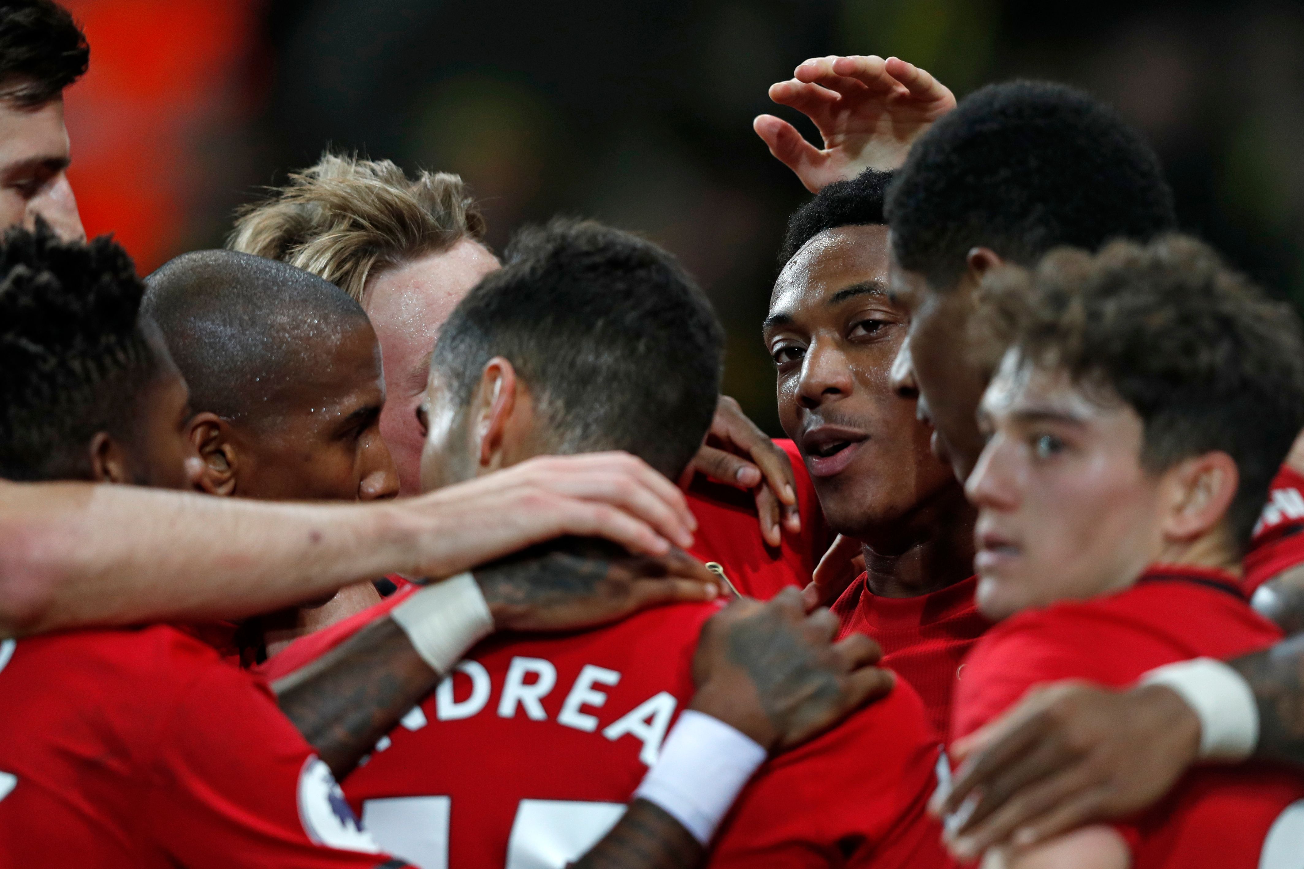 Manchester United's French striker Anthony Martial (C) celebrates with teammates after scoring their third goal during the English Premier League football match between Norwich City and Manchester United at Carrow Road in Norwich, eastern England on October 27, 2019. (Photo by Adrian DENNIS / AFP) / RESTRICTED TO EDITORIAL USE. No use with unauthorized audio, video, data, fixture lists, club/league logos or 'live' services. Online in-match use limited to 120 images. An additional 40 images may be used in extra time. No video emulation. Social media in-match use limited to 120 images. An additional 40 images may be used in extra time. No use in betting publications, games or single club/league/player publications. /  (Photo by ADRIAN DENNIS/AFP via Getty Images)