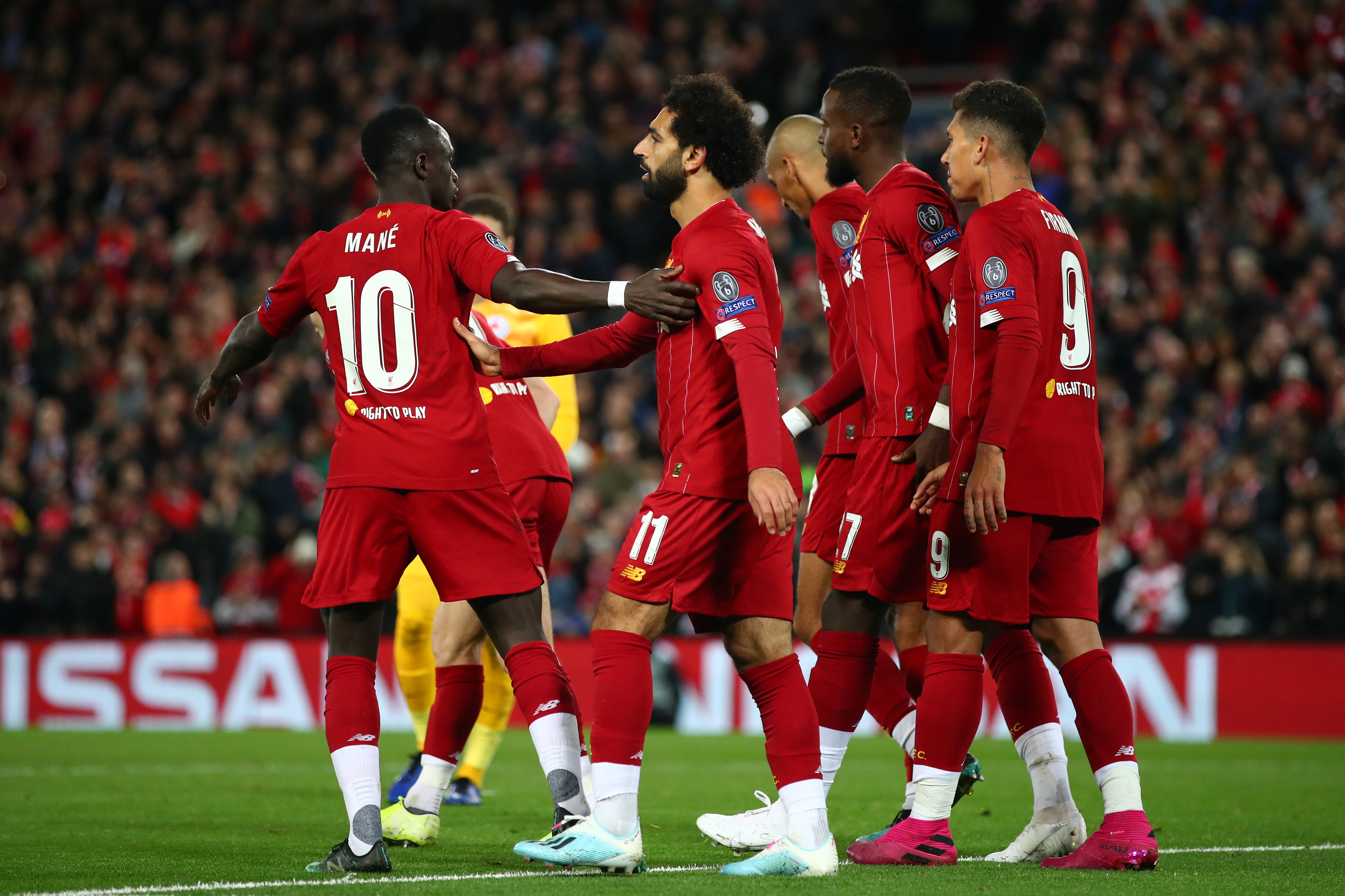 LIVERPOOL, ENGLAND - OCTOBER 02: Mohamed Salah of Liverpool celebrates with Sadio Mane after he scores his sides fourth goal during the UEFA Champions League group E match between Liverpool FC and RB Salzburg at Anfield on October 02, 2019 in Liverpool, United Kingdom. (Photo by Clive Brunskill/Getty Images)