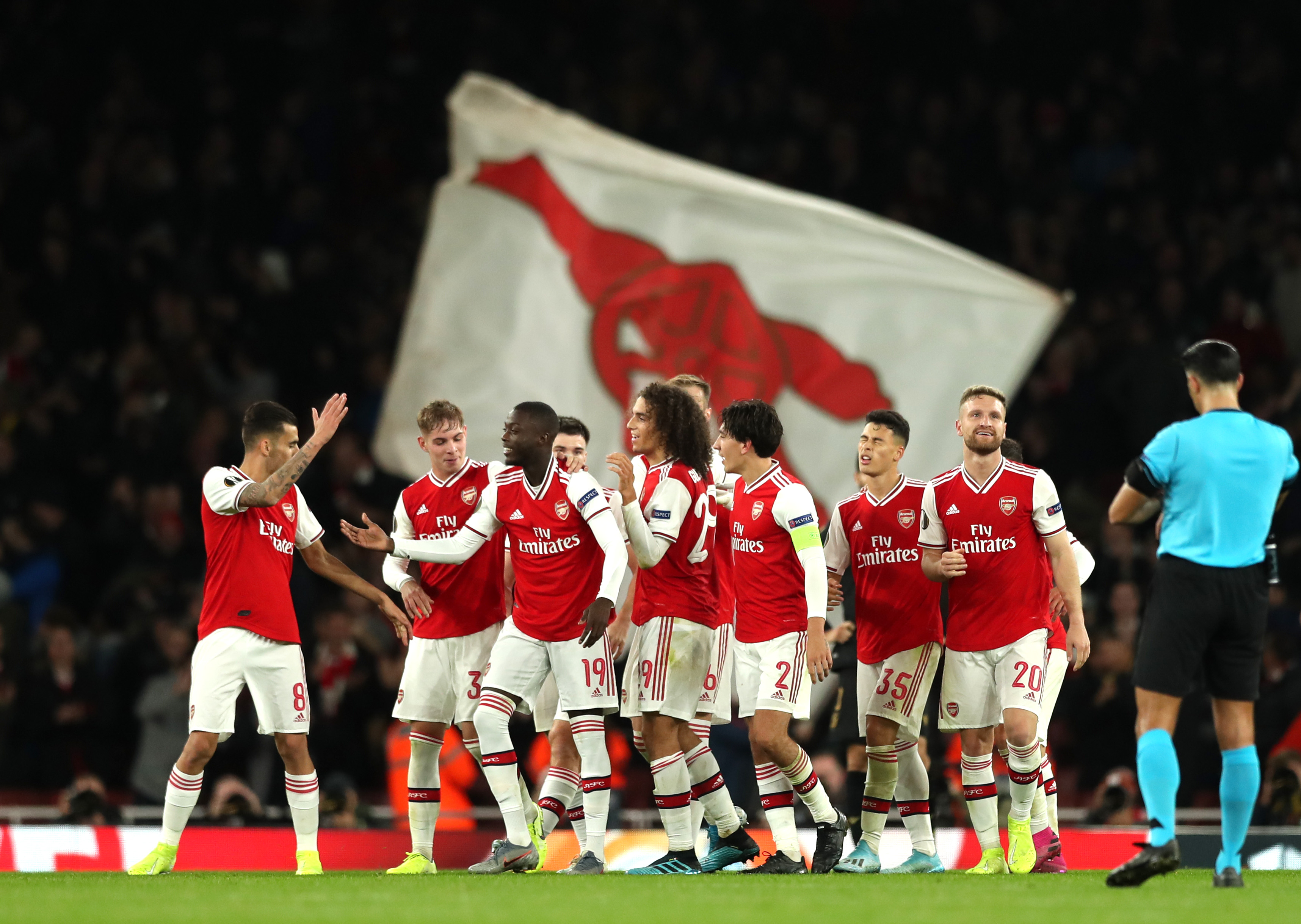 LONDON, ENGLAND - OCTOBER 24: Nicolas Pepe of Arsenal celebrates with team mates after scoring his team's third goal during the UEFA Europa League group F match between Arsenal FC and Vitoria Guimaraes at Emirates Stadium on October 24, 2019 in London, United Kingdom. (Photo by Naomi Baker/Getty Images)