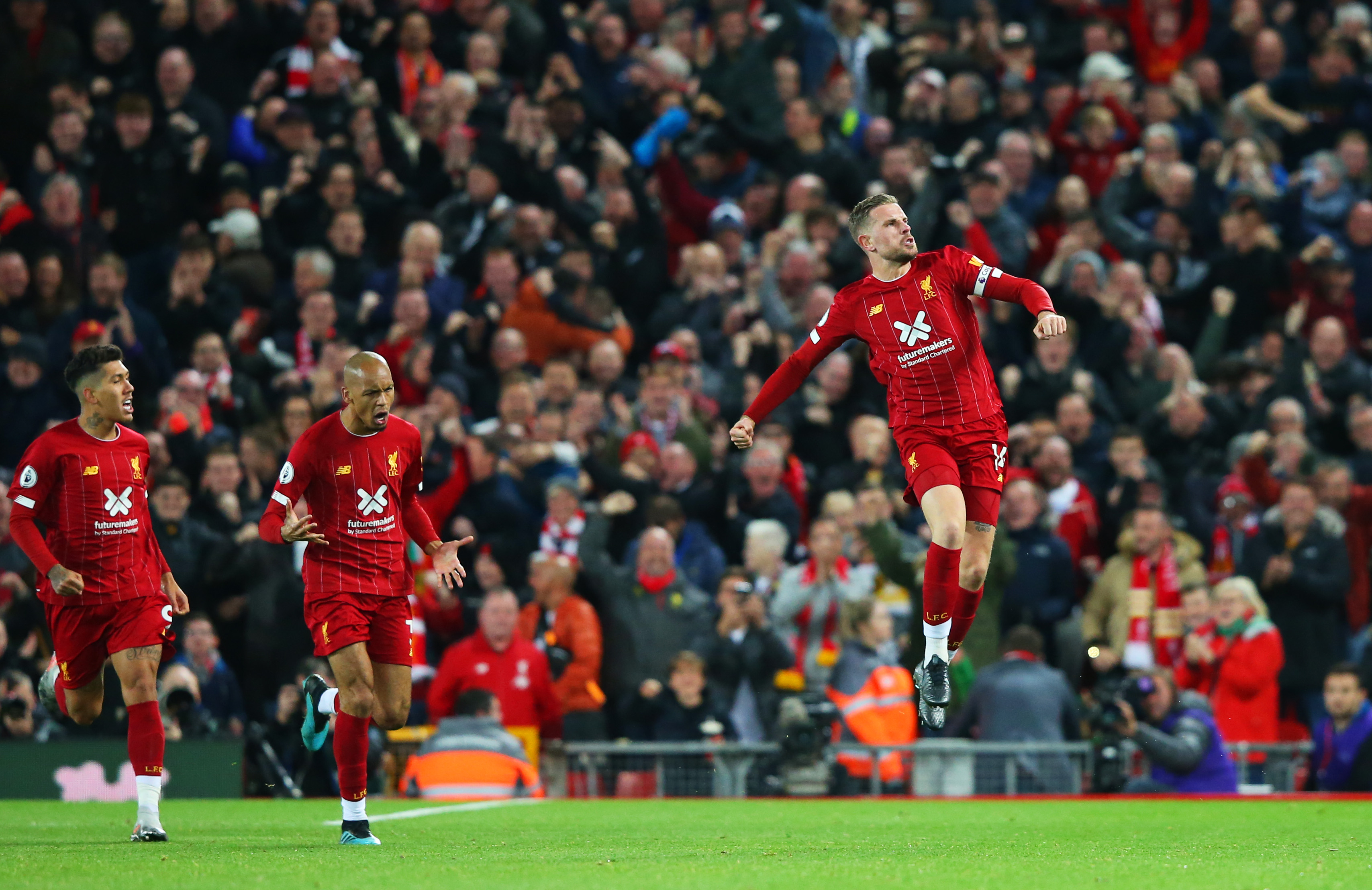 LIVERPOOL, ENGLAND - OCTOBER 27:  Jordan Henderson of Liverpool celebrates after scoring his team's first goal during the Premier League match between Liverpool FC and Tottenham Hotspur at Anfield on October 27, 2019 in Liverpool, United Kingdom. (Photo by Alex Livesey/Getty Images)