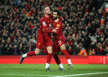 LIVERPOOL, ENGLAND - OCTOBER 27:  Mohamed Salah of Liverpool (11) celebrates as he scores his team's second goal from a penalty with Jordan Henderson during the Premier League match between Liverpool FC and Tottenham Hotspur at Anfield on October 27, 2019 in Liverpool, United Kingdom. (Photo by Jan Kruger/Getty Images)