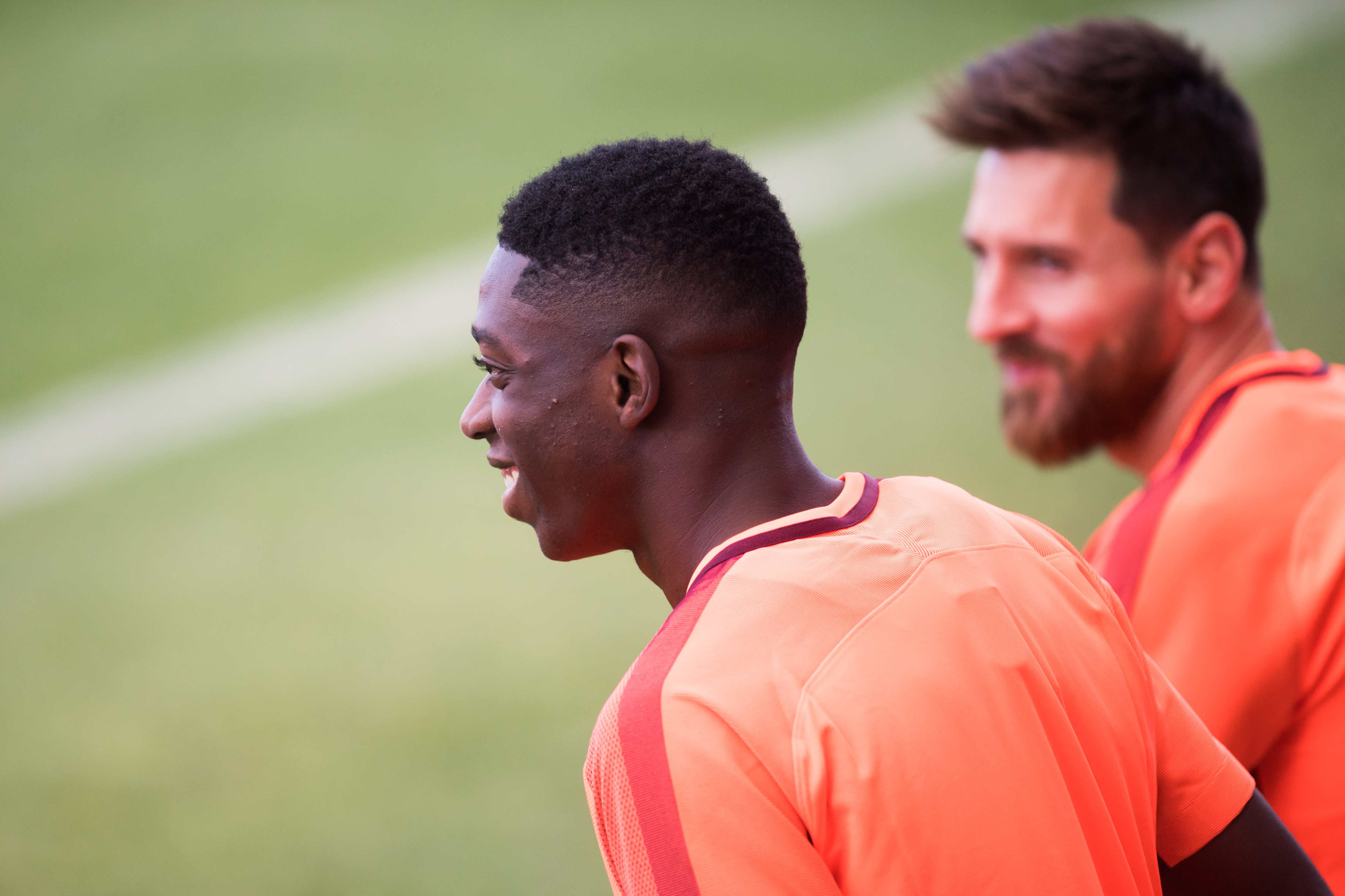 BARCELONA, SPAIN - SEPTEMBER 11: Ousmane Dembele of Lionel Messi of FC Barcelona enter the pitch during a training session ahead of the UEFA Champions League Group D match against Juventus on September 11, 2017 in Barcelona, Spain.  (Photo by Alex Caparros/Getty Images)