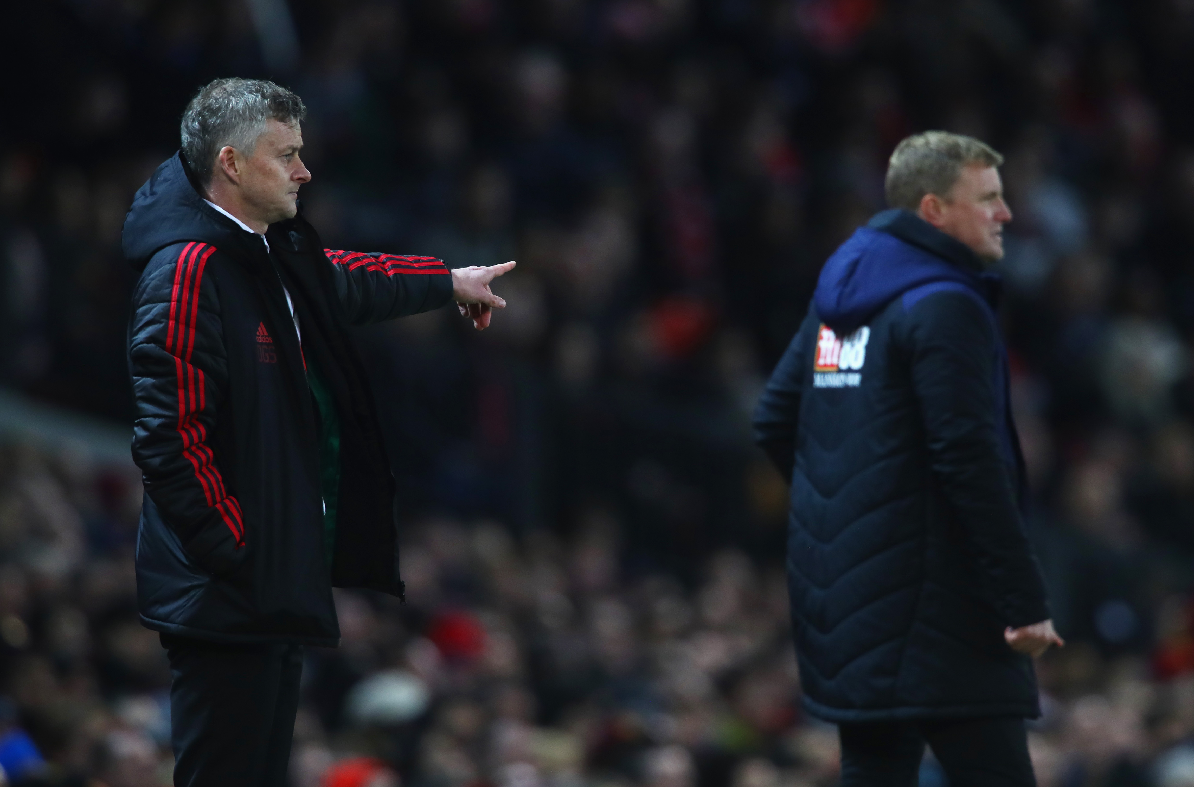 MANCHESTER, ENGLAND - DECEMBER 30:  Ole Gunnar Solskjaer, Interim Manager of Manchester United points as Eddie Howe, Manager of AFC Bournemouth looks on during the Premier League match between Manchester United and AFC Bournemouth at Old Trafford on December 30, 2018 in Manchester, United Kingdom.  (Photo by Clive Brunskill/Getty Images)
